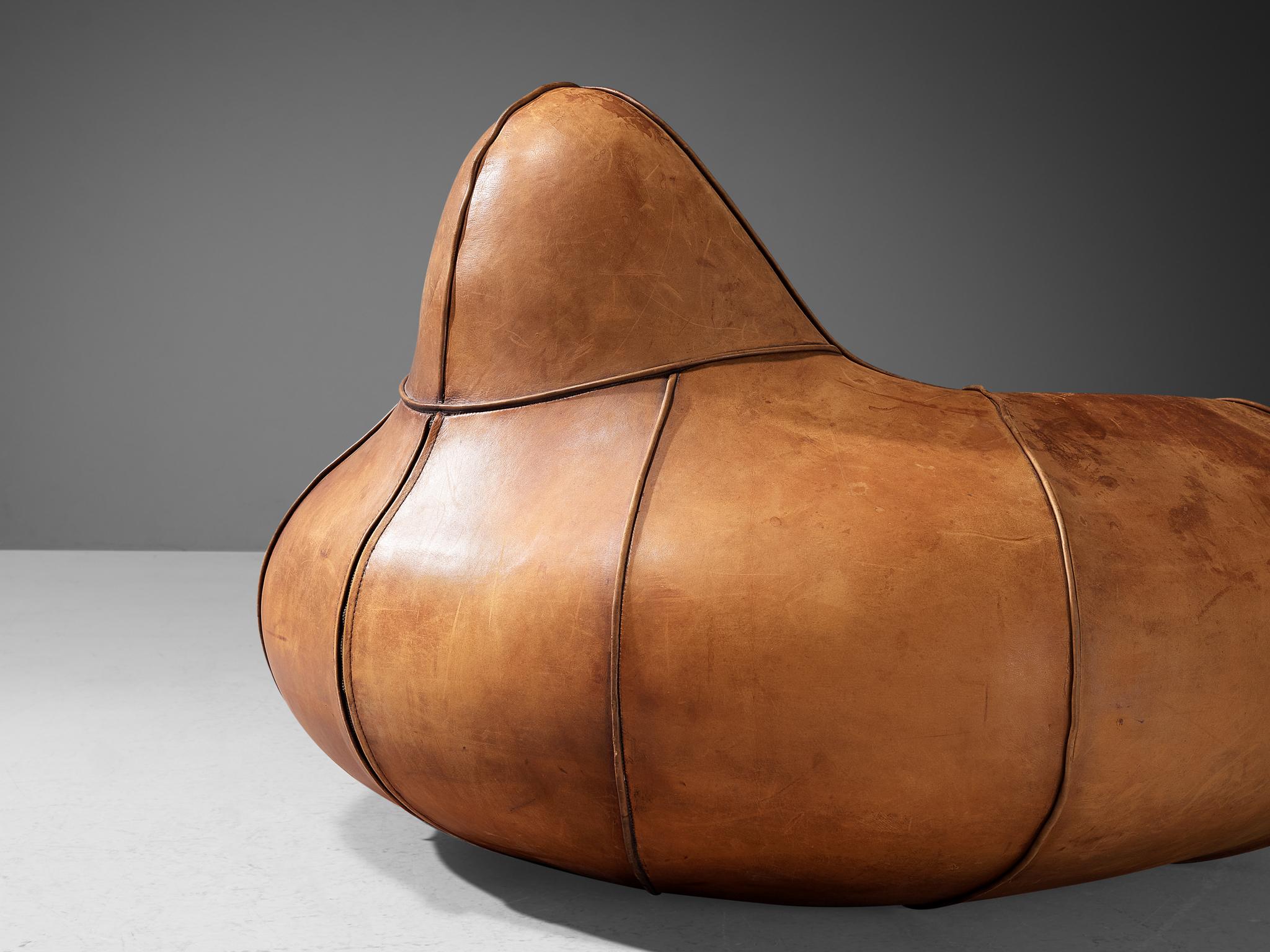 Lounge chair, leather, Europe, 1970s

An exceptionally crafted design featuring bulky curves and rounded contours, accentuated by meticulous stitching. The design of this chair resembles sculptural forms, with a soft, cocoon-like look that feels