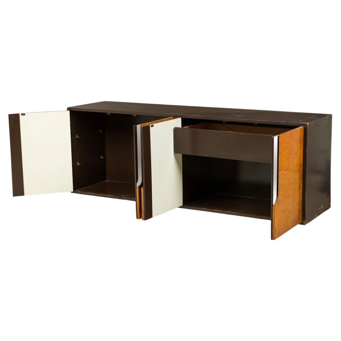 Post modern burl chrome and lacquer wall mounted floating credenza. Great modern credenza with stunning burl doors and brown lacquer finish. Chrome handles on all 4 doors with 1 drawer on the right and 2 adjustable shelves on the left side. Made to