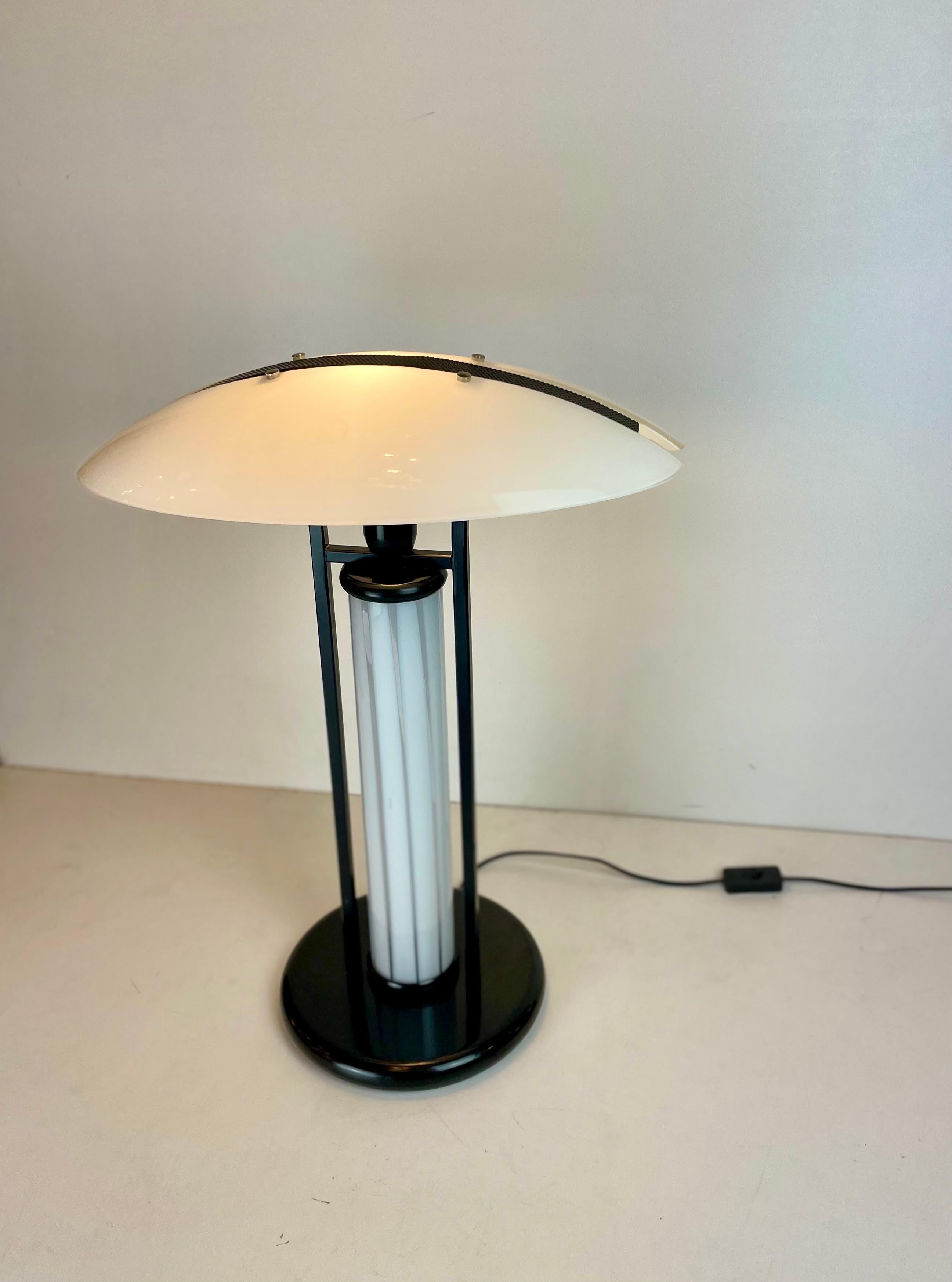 Tall Post-Modern table lamps made in white Murano glass and black painted metal, designed in Italy in the style of Zonca in the 1980’s.
-
Origin: Italy
Design period: 1980’s
Materials: glass, metal
Color: black, white
Dimensions: H 63 x D 58 cm
Two