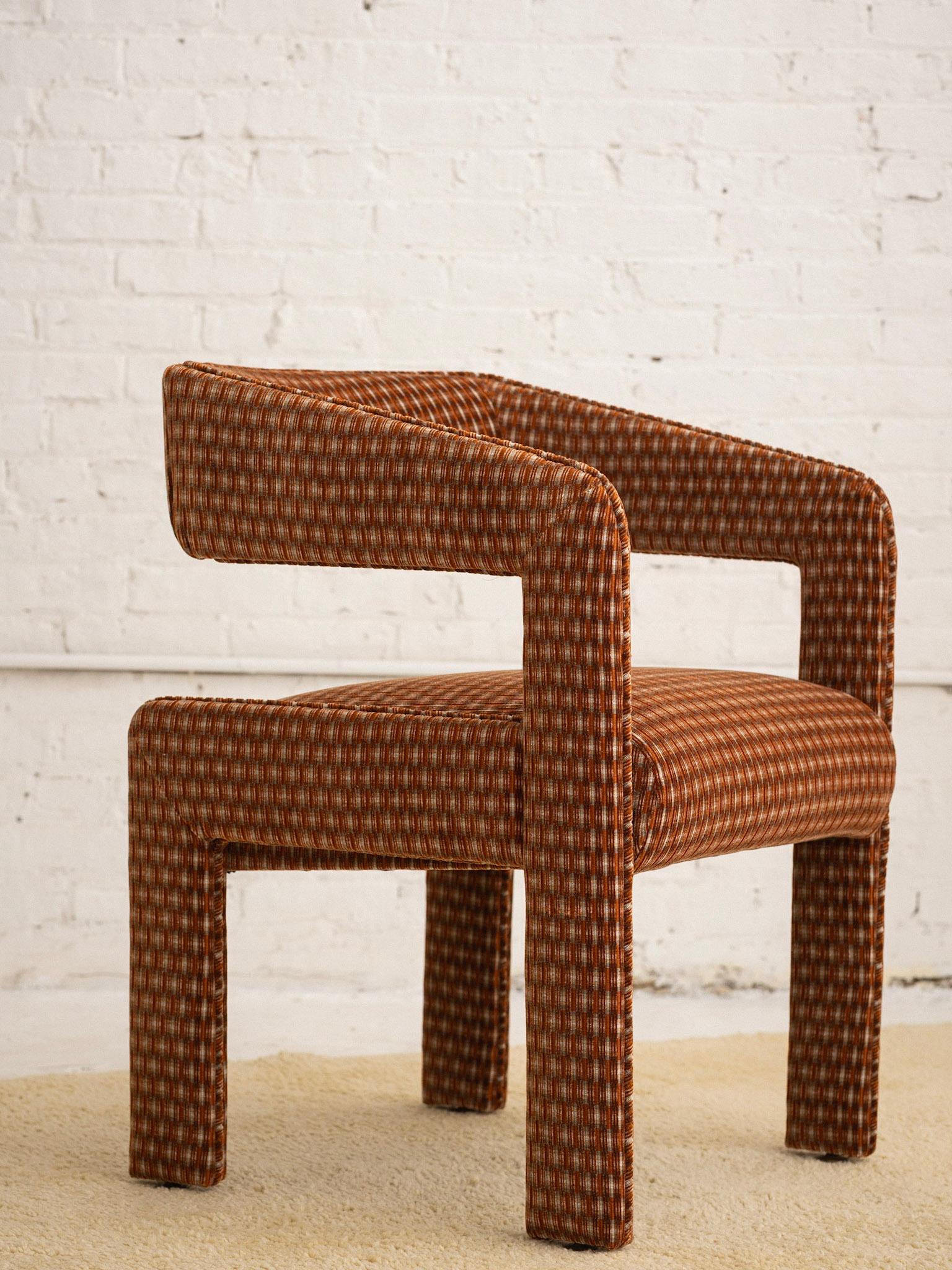 A sculptural post modern armchair. Cantilevered back appears to 