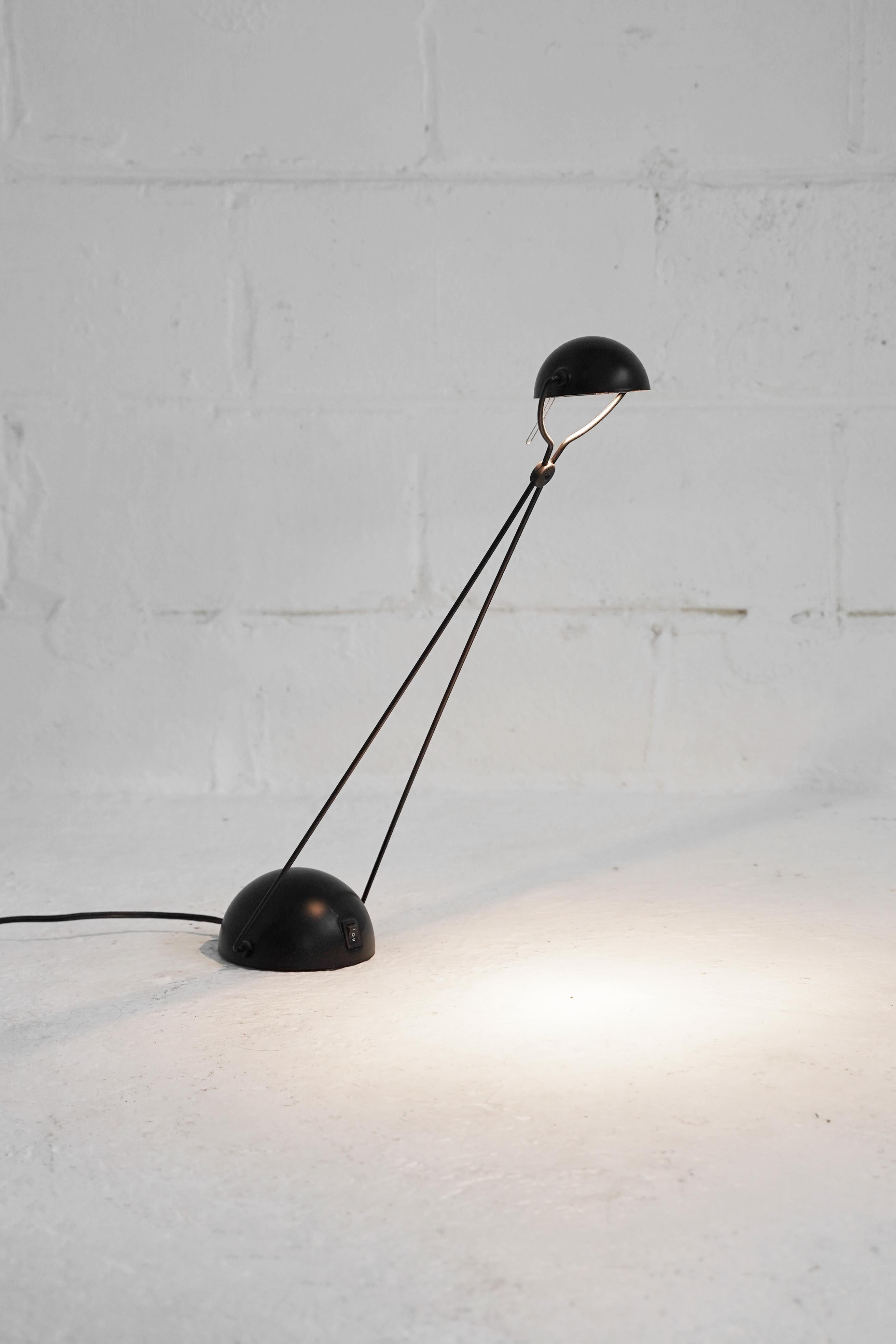 Minimal and elegant counterweight halogen table wall lamp designed in the style of Paolo Francesco Piva for Stephano Cevoli. We have one in a brass and black finish. In working condition.