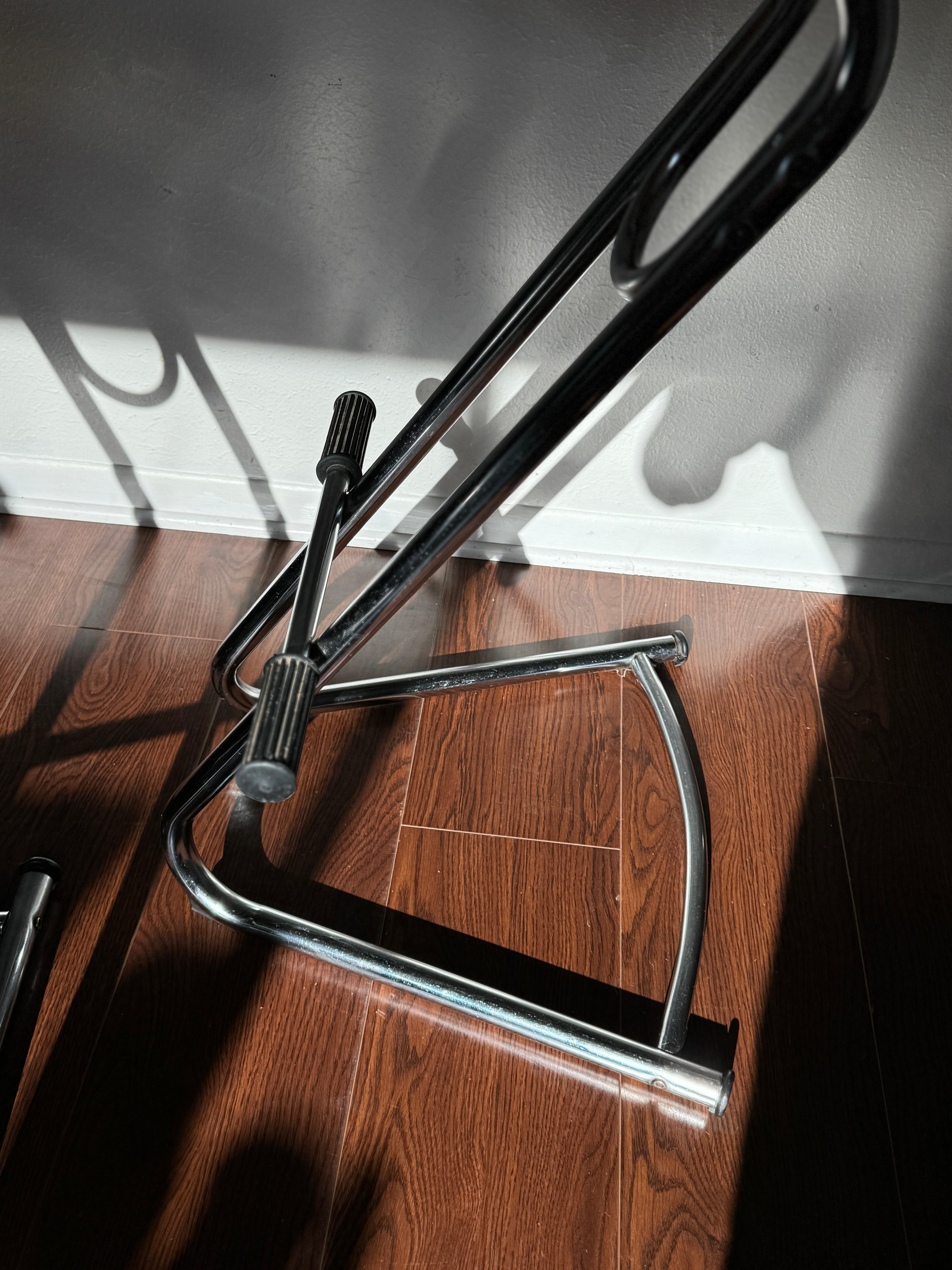 Post modern cantilevered set of chrome and black vinyl barstools, circa 1990s For Sale 1