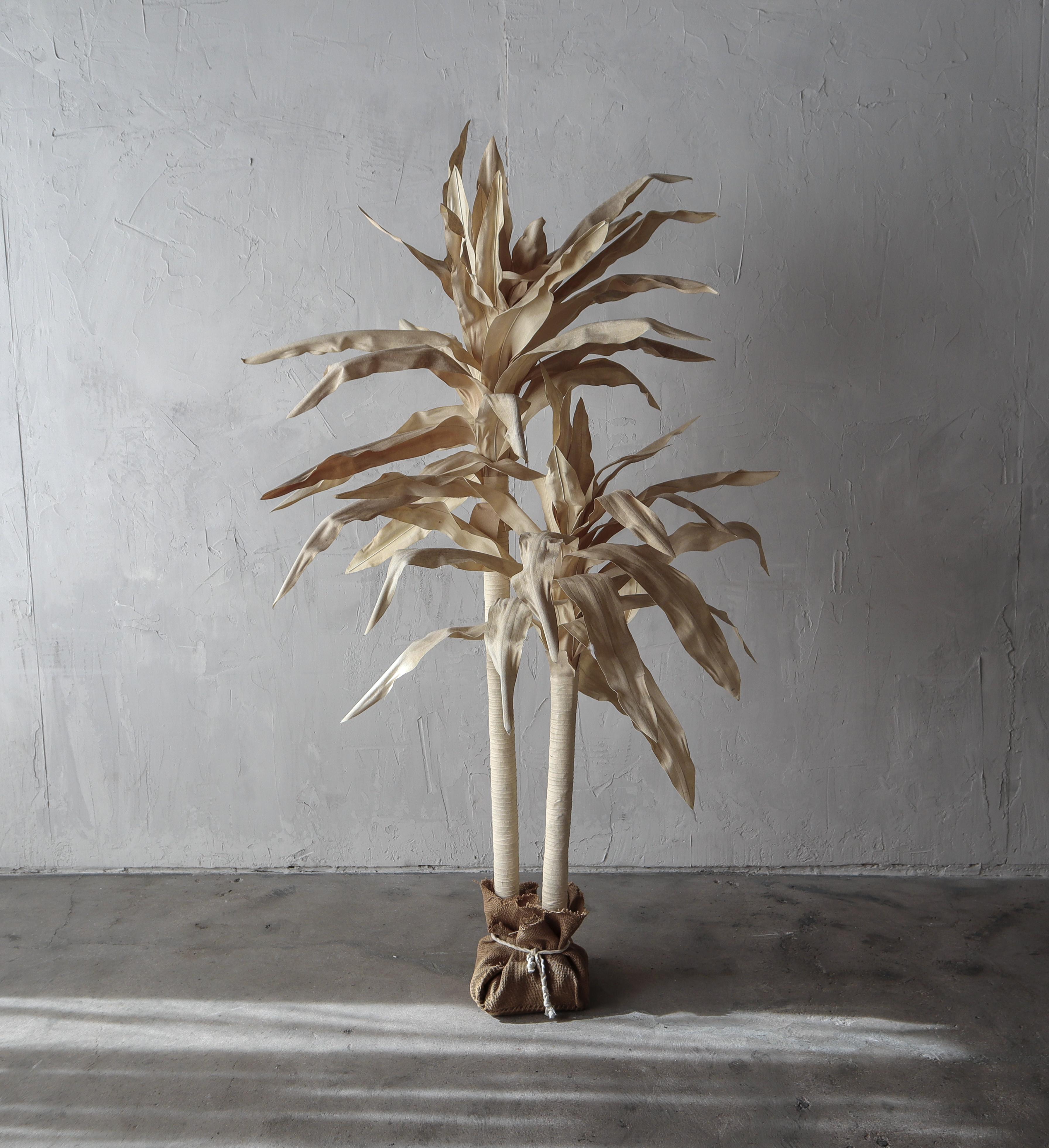 Incredible Post Modern canvas Dracaena tree. Super cool, super sculptural. Created out of canvas over metal.

Tree has what I'd consider patina, water marks etc. but it truly adds to the depth and interest of the piece, see images.

Dimensions