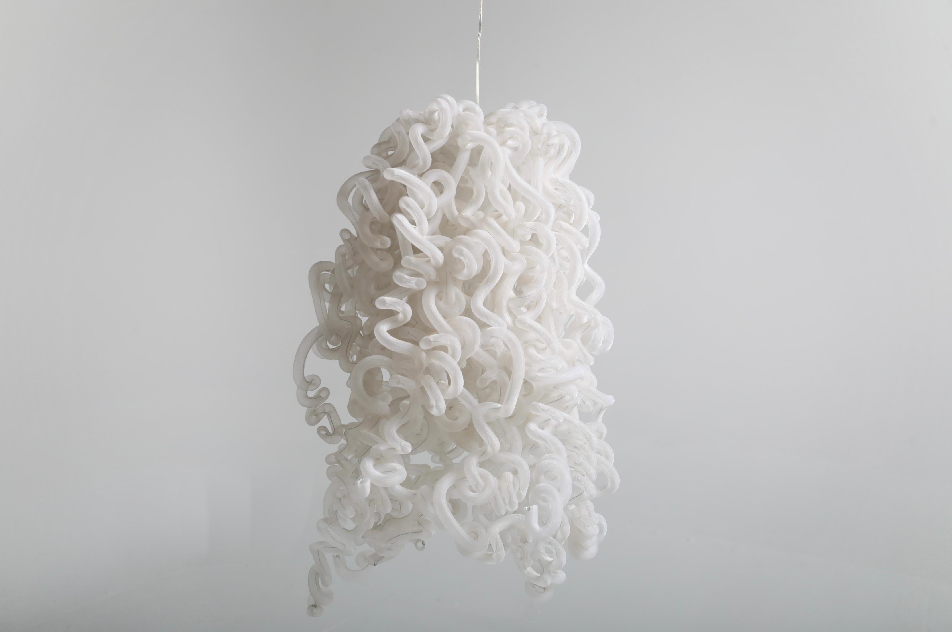 Ceiling lamp designed by Tina Leung during the 1990s. The sculptural shade is made from translucent plastic tubes, arranged in an expressive, cloud-like formation that creates depth and a captivating play of light when illuminated. A distinctive