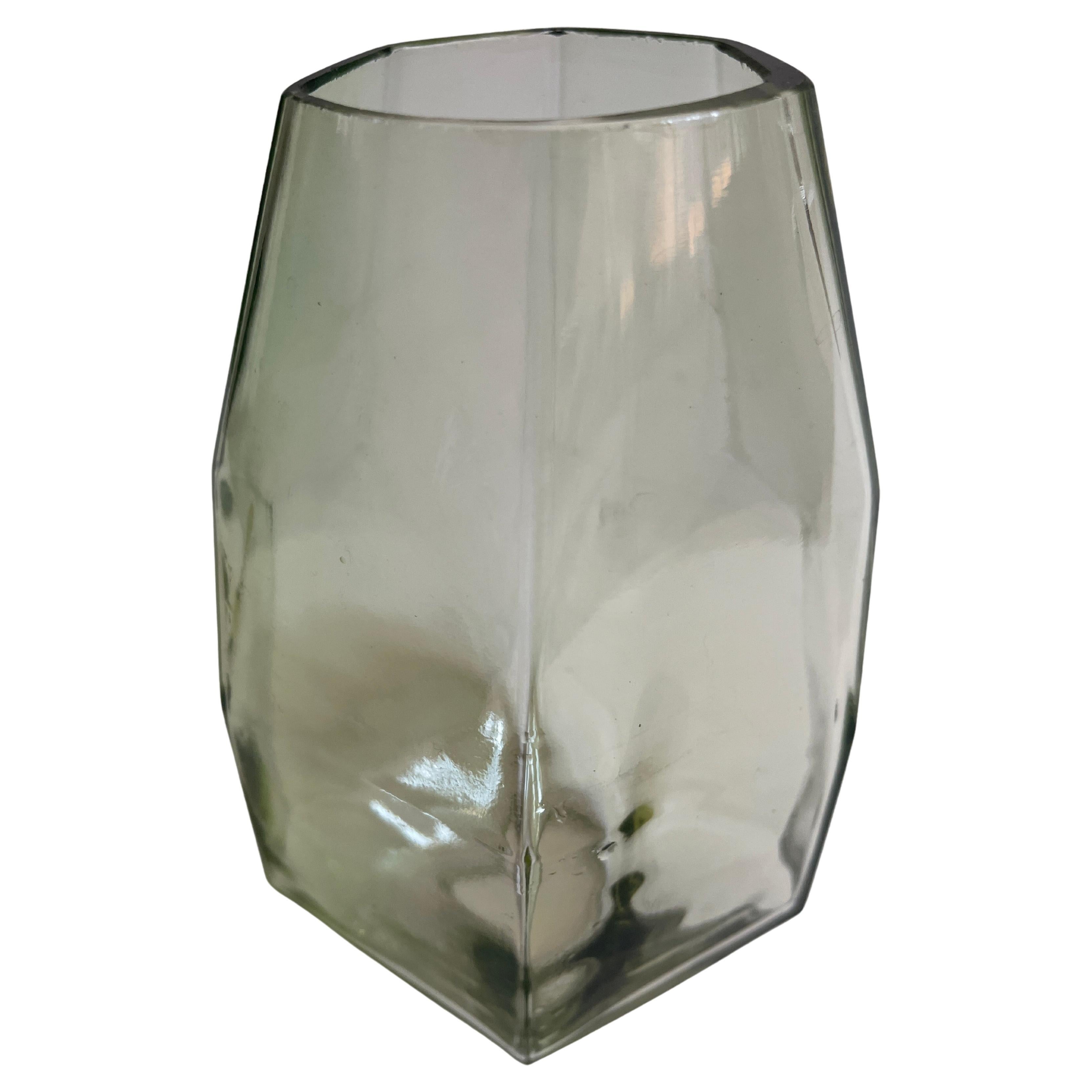 Polyhedric Danish glass vase has an ethereal celadon color, catching the light at many angles.