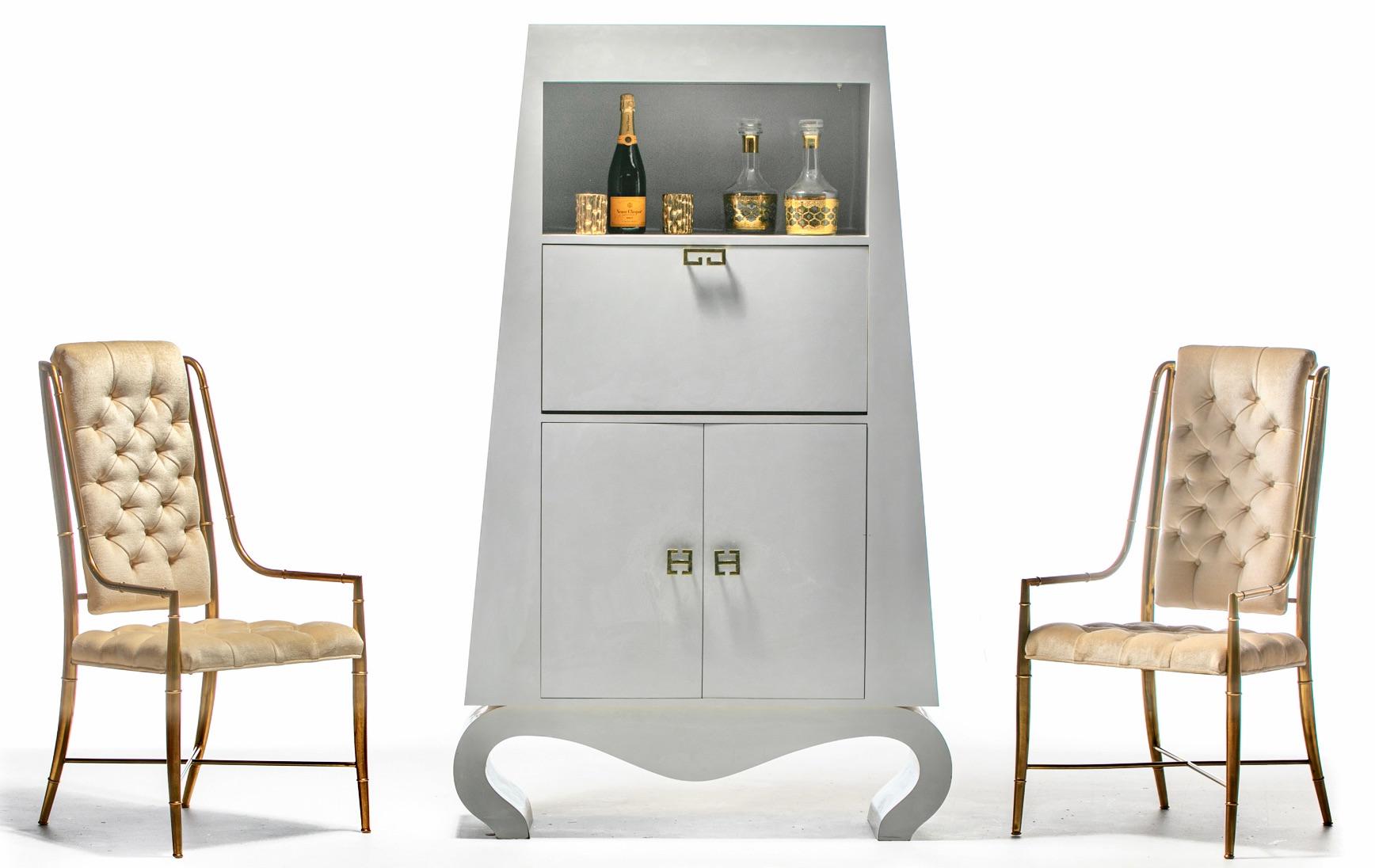 A really fun Post Modern bar cabinet with a Chinoiserie nod that adds an uplifting air whether in or out of use into any space. Go from sexy sculptural cabinet to chic cocktail party in just one flap. Drop down counter is perfect for mixing your