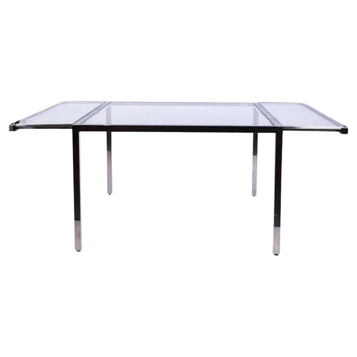 Post Modern Chrome and Glass dining table with 2 Glass leaves In Good Condition For Sale In BROOKLYN, NY
