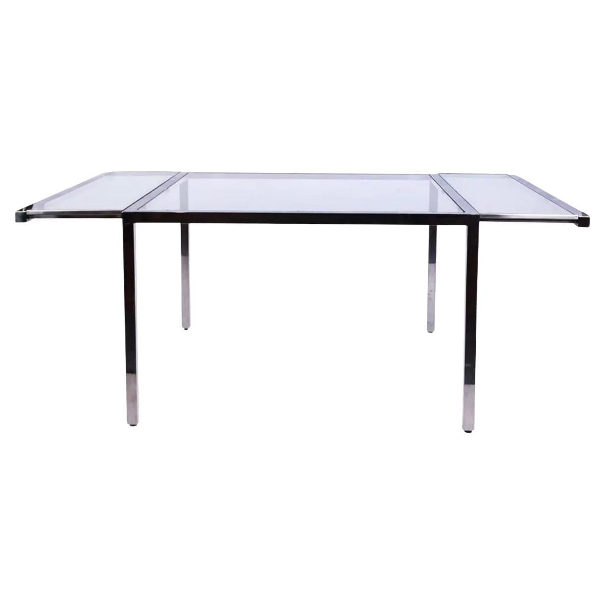 Post Modern Chrome and Glass dining table with 2 Glass leaves