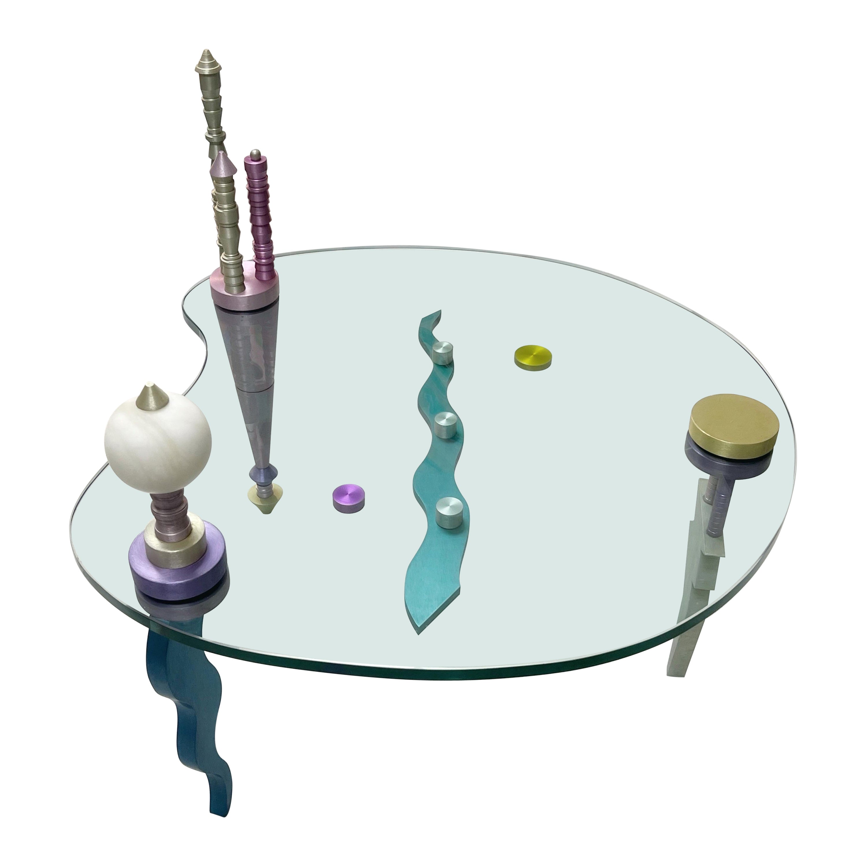 Post Modern Coffee Table Glass and Colorful Sculpture Metal 1980s