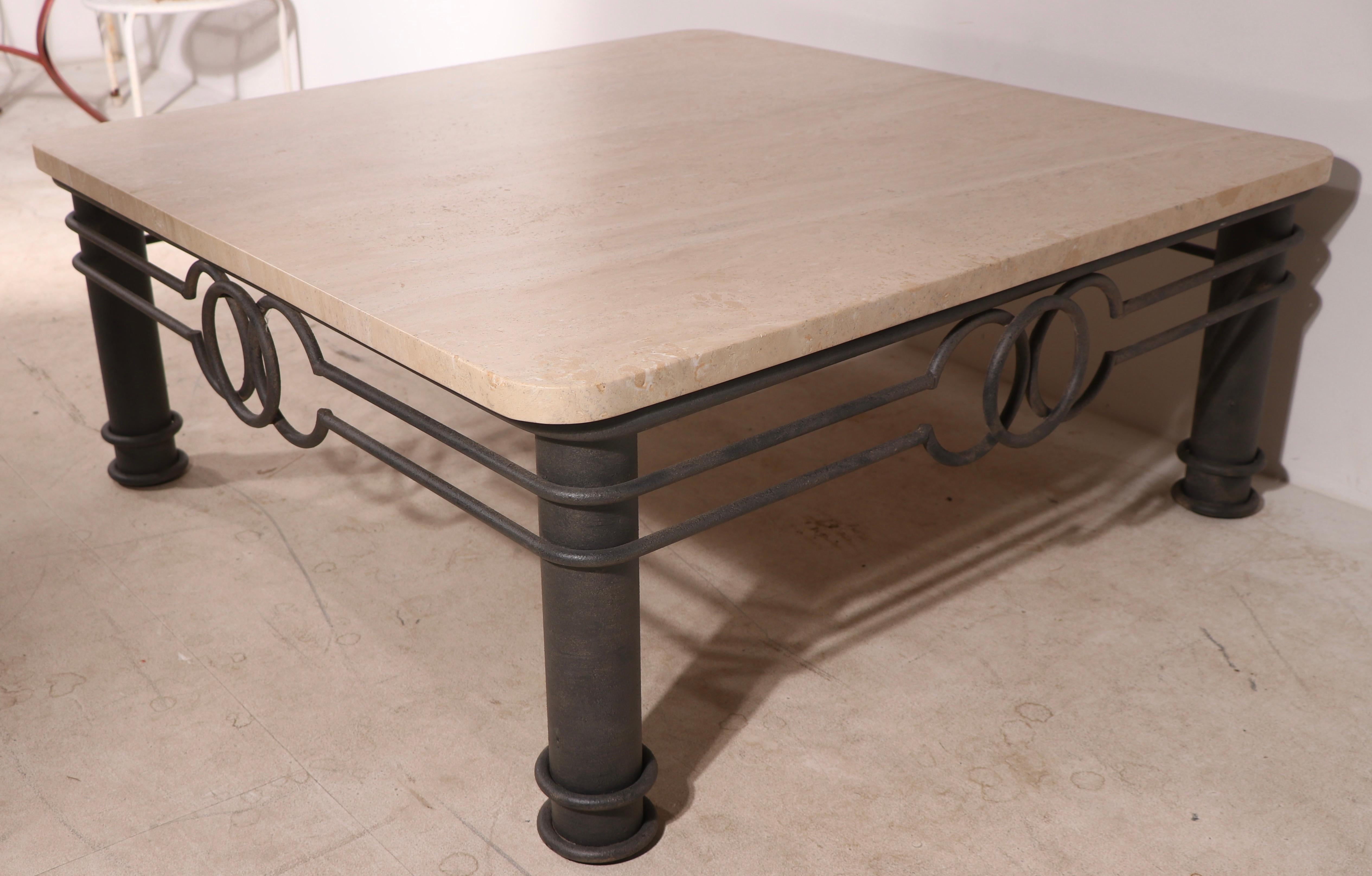 Impressive marble top, wrought iron and steel based coffee, cocktail table reminiscent of the work of Arturo Pani. The thick marble top (3.5 in.) is marked Hecho en Mexico. This example is in very good, original, clean and ready to use condition,