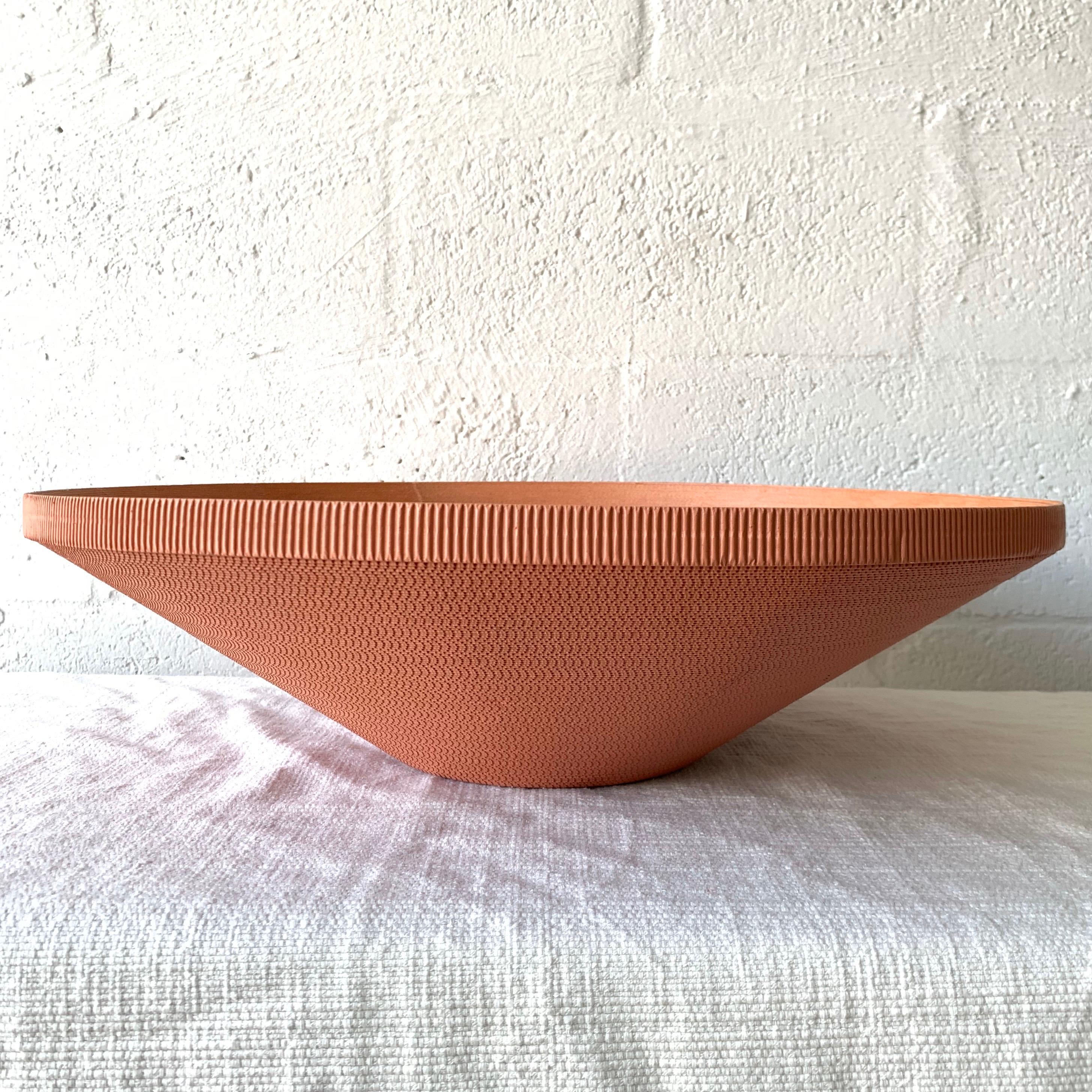 Postmodern bowl or vessel rendered in mauve pink painted corrugated cardboard, reminiscent of easy edges line by Frank Gehry.