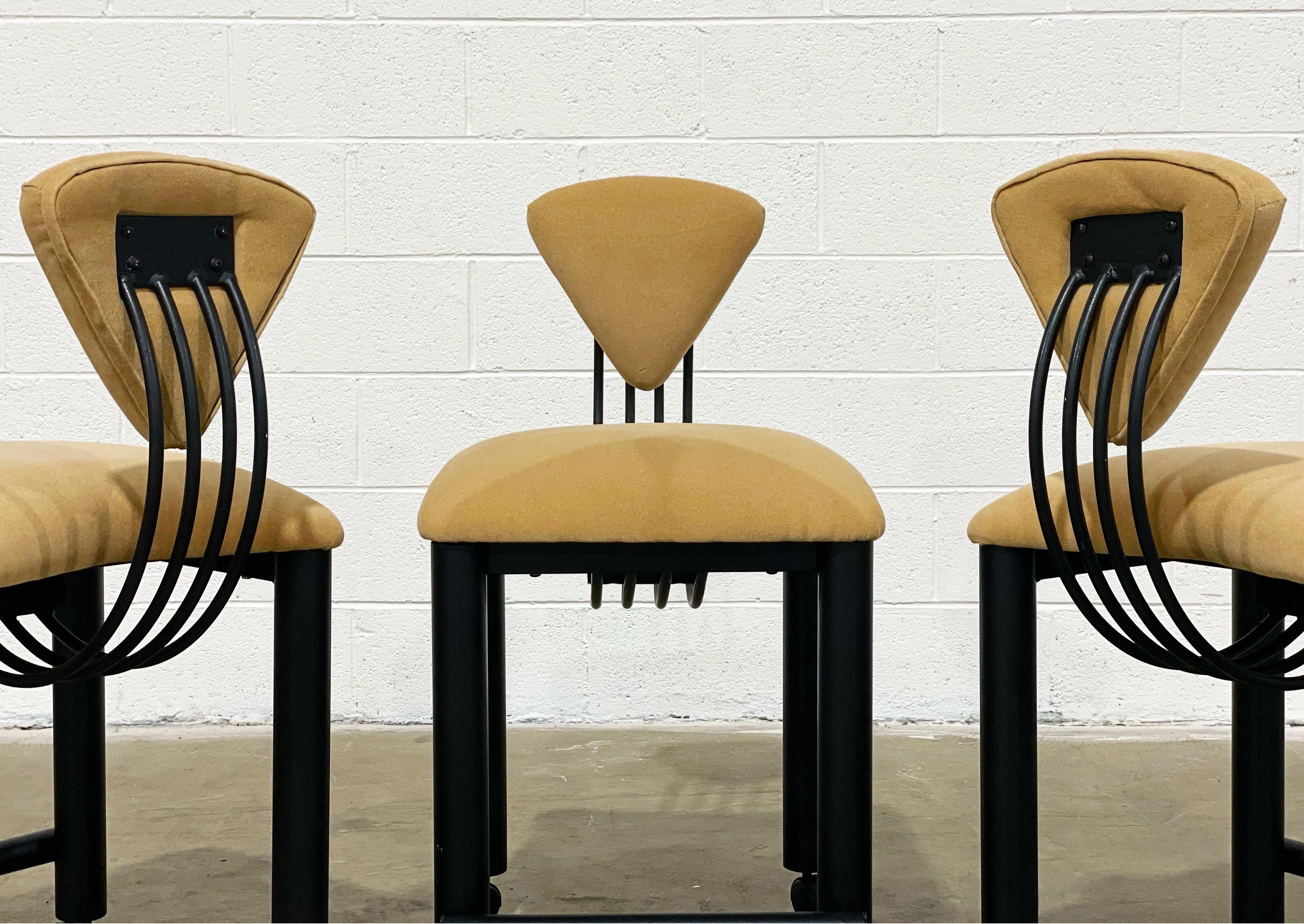 Post Modern Memphis Milano style counter height barstools on casters. Black lacquered metal frames saddle tone velvet upholstered seat and backrest. Appealing from any angle.
These are counter height bar stools, not bar height.
Three stools