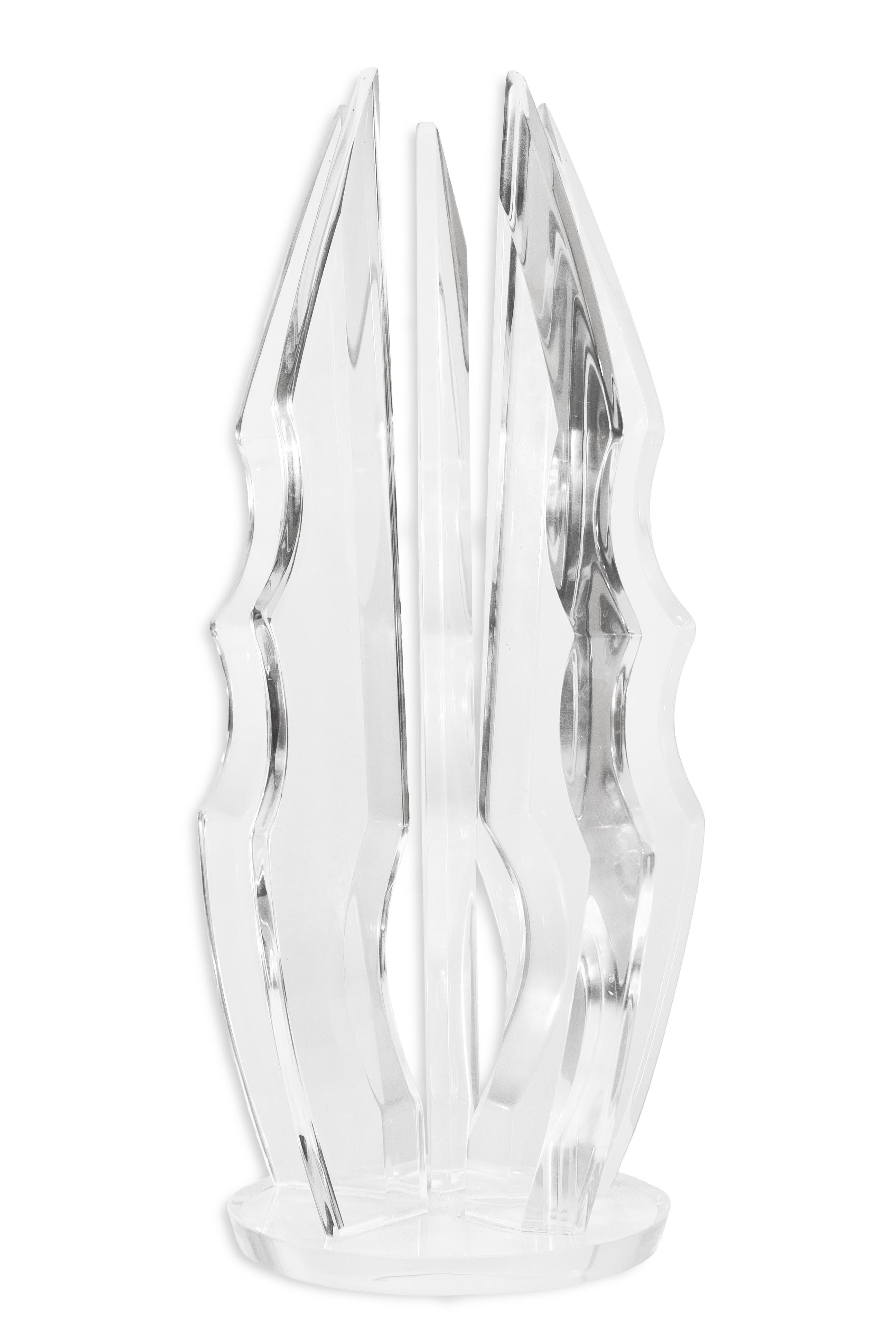 This is a post-modern lucite table sculpture in the style of Van Teal. The entire piece is crafted from lucite, including the base and the arms that extend from the top. The sculpture features a highly angular design with a sharp appearance. It is