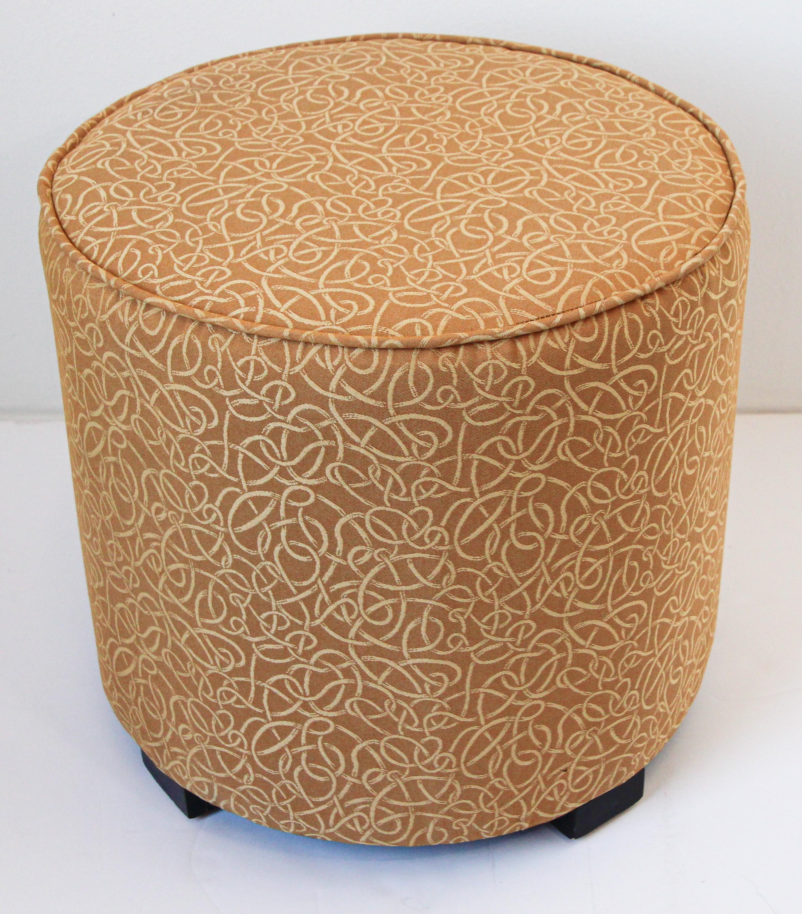 Art Deco Style Moroccan pouf in gold fabric upholstery. Art Deco Style round Moroccan style upholstered stools in gold fabric upholstery. 
Moroccan Art Deco Style little pouf hassock, upholstered footstool or modern circular ottoman. 
This versatile