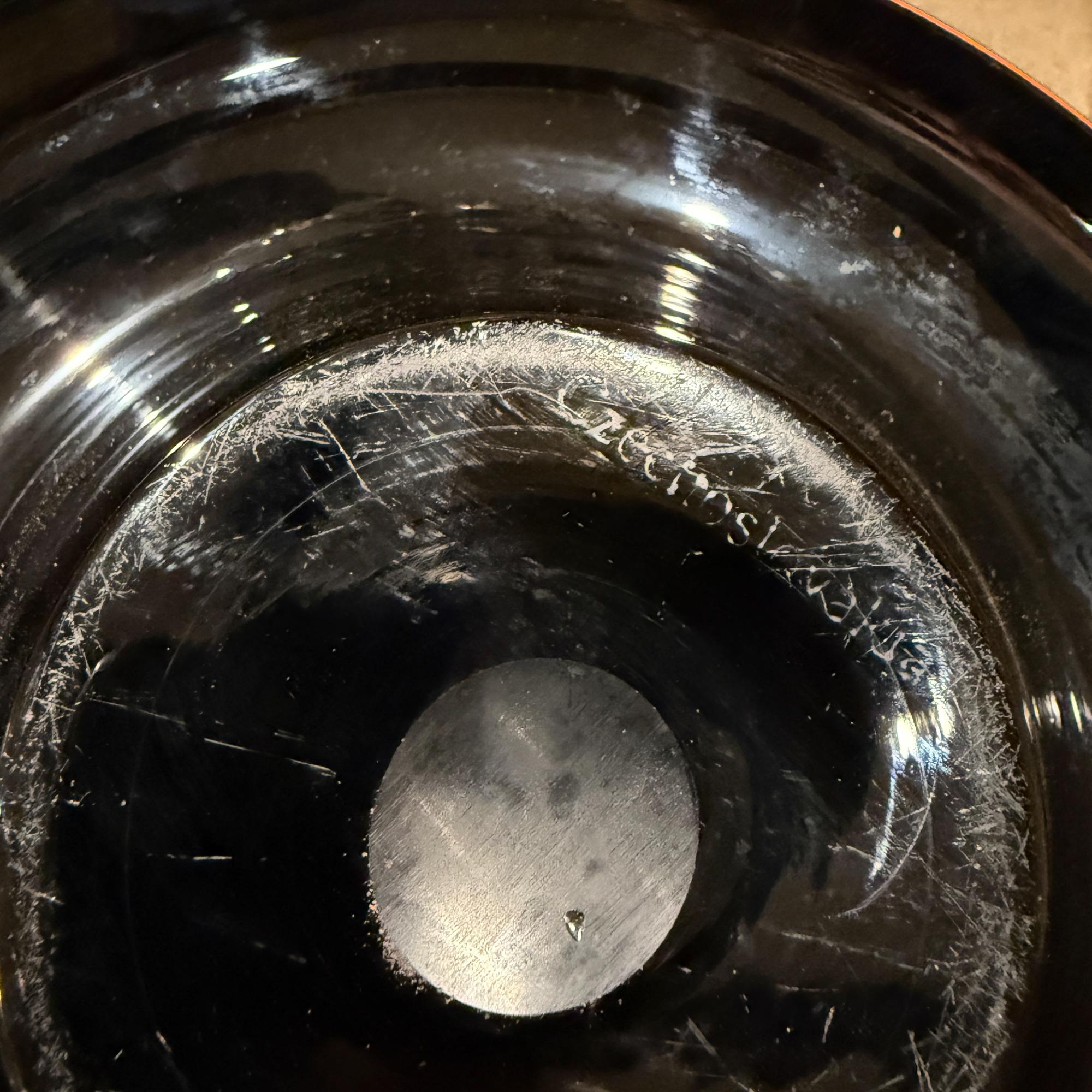 For your consideration, a decorative post-modern art glass bowl in orange and black colors. Fantastic sculptural Czechoslovakian design. Stamped underneath.

Dimensions: 2.75