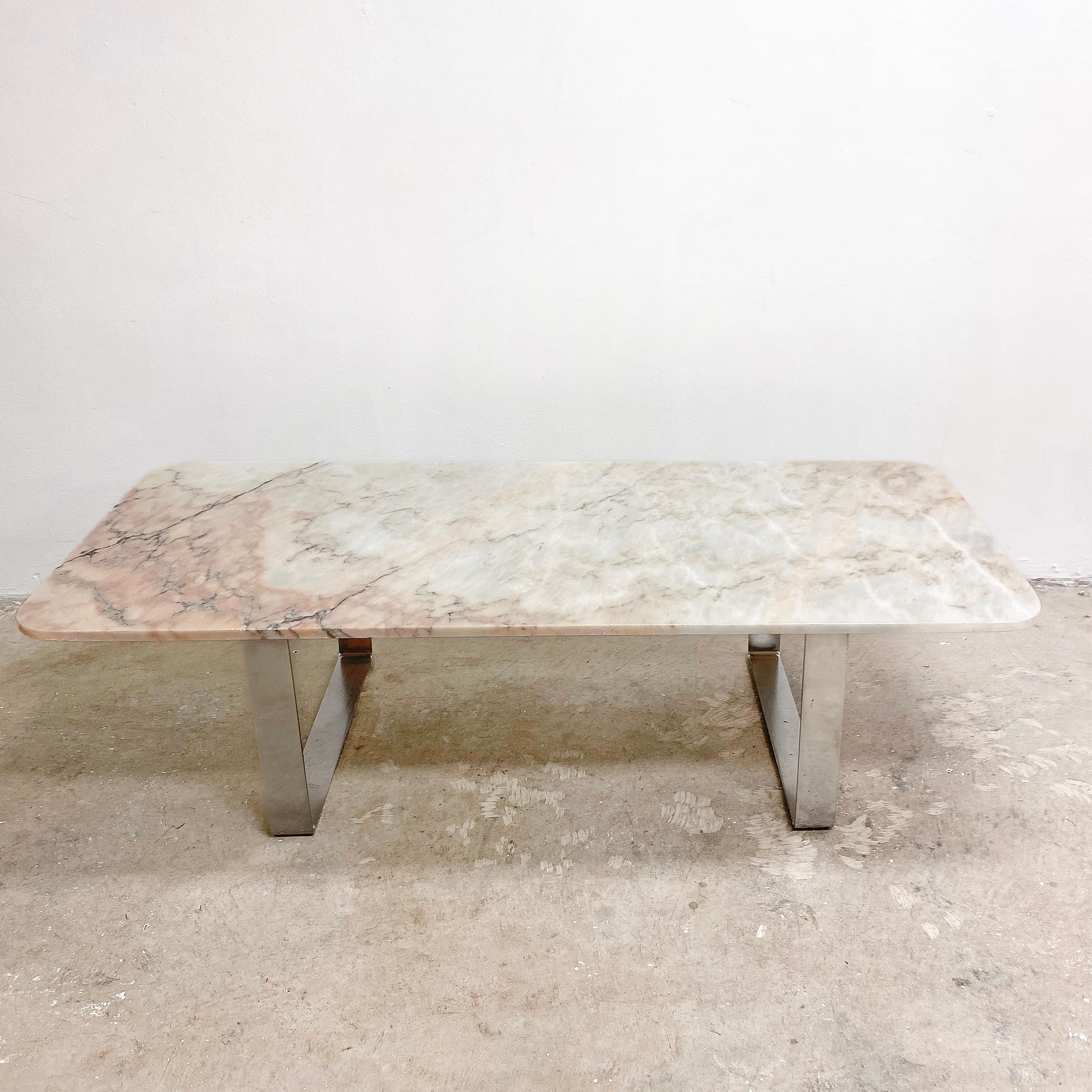 Stunning Danish post modern coffee table, with gorgeous pink Italian Carrara marble top and sleek minimal chrome base. A statement piece which would easily work in any contemporary home setting. In great condition, with minor signs of use