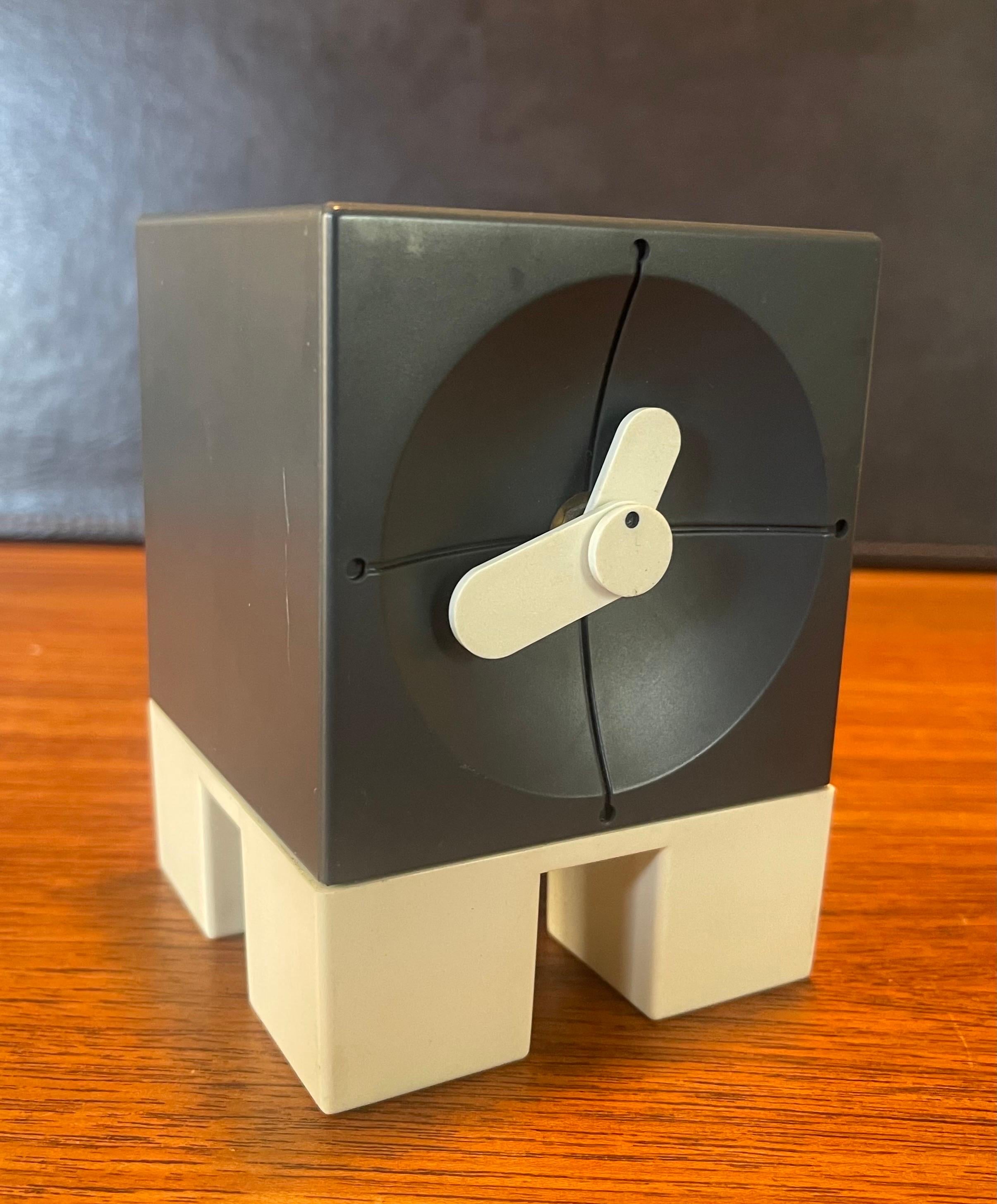A very cool post-modern desk clock by ETC USA, circa 1980s. The piece has a great minimalist look and is in very good condition with no chips or cracks. It is battery-operated quartz movement and measures 3.5