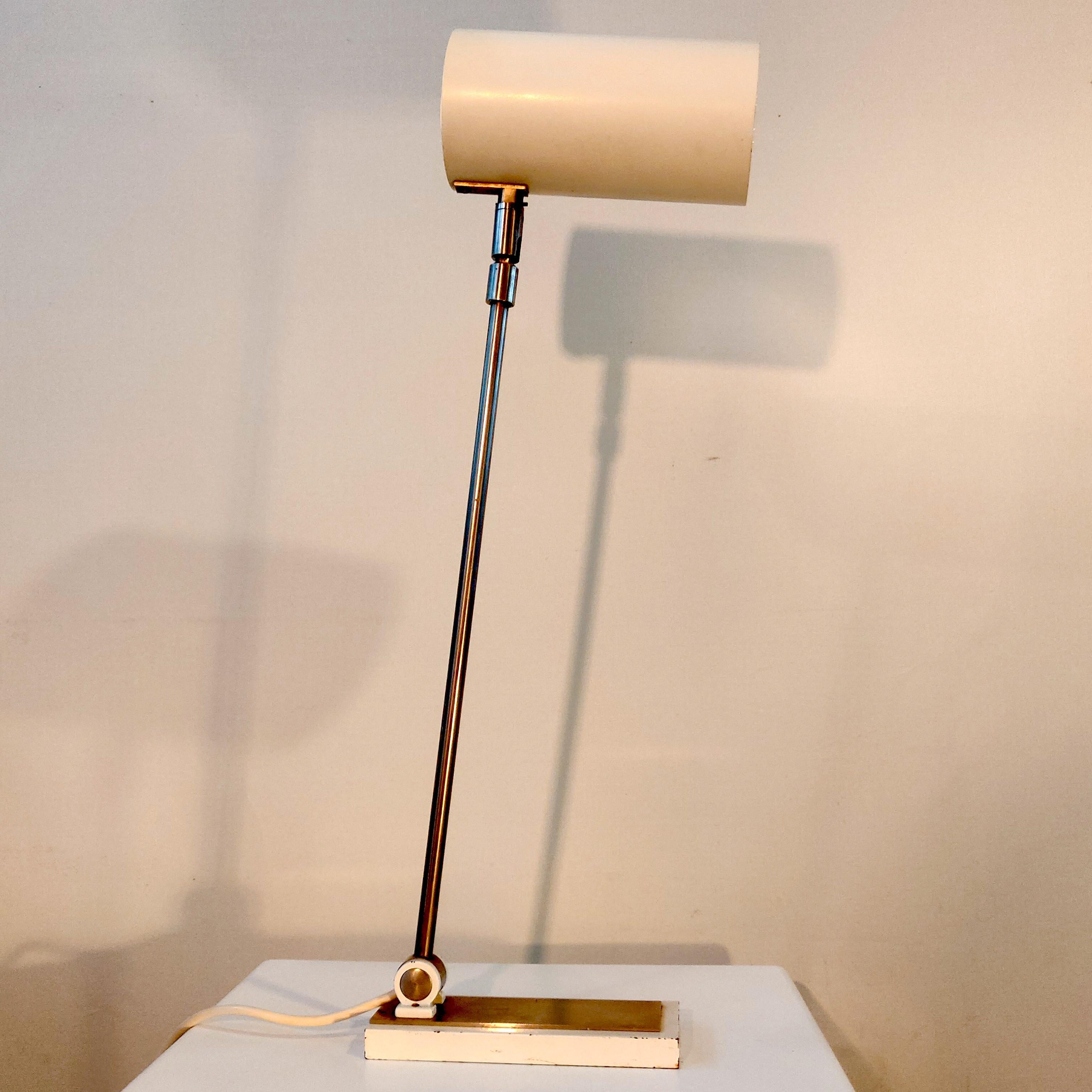 Desk lamp with tubular shade by the dutch company Hala Zeist, 1970s. Post modern design with a tubular lamp shade closed off on the back side by a piece of acrylic giving it a special touch. The lamp shade can tilt up and down, the chrome stem can