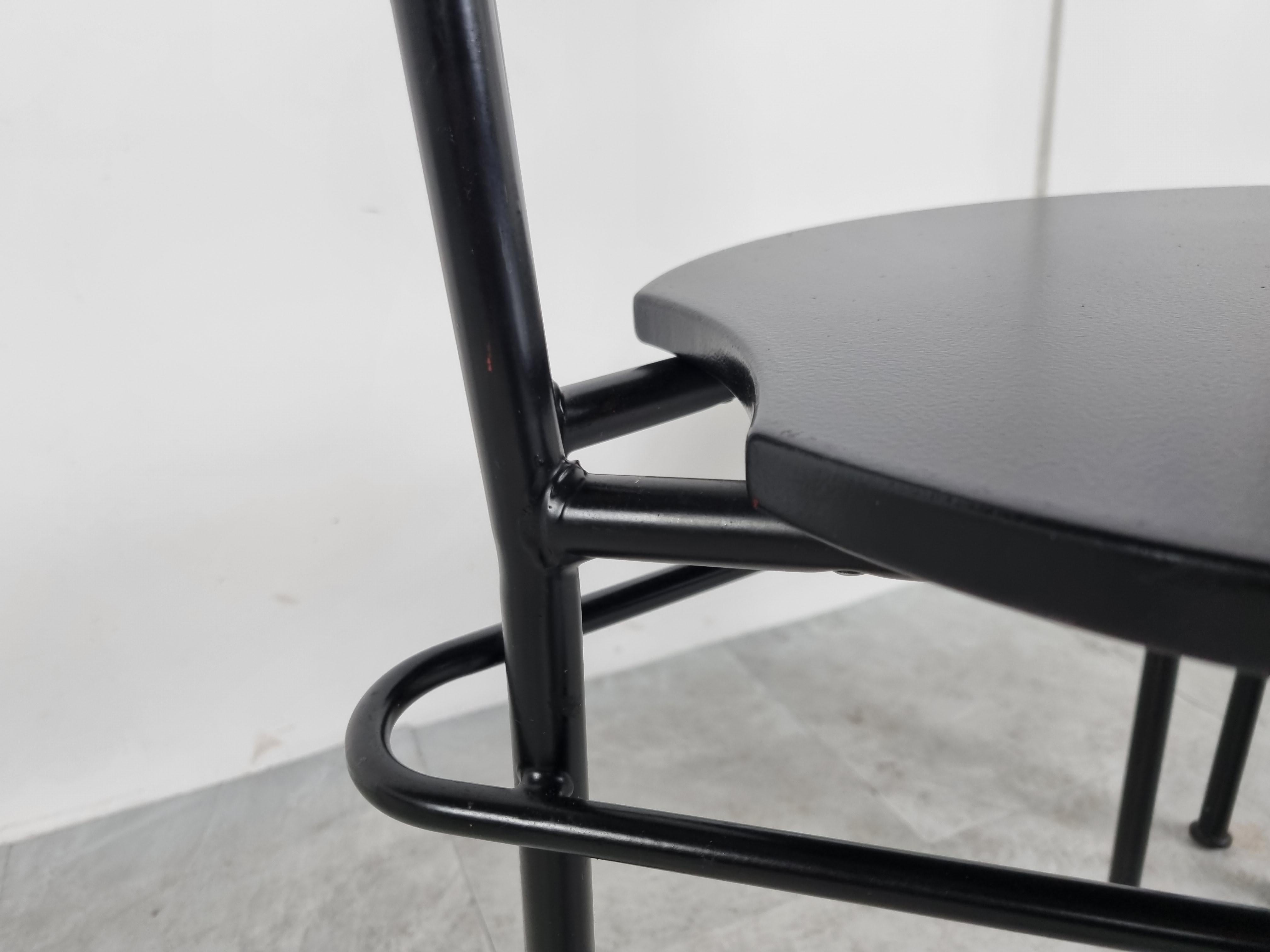 Post modern dining chairs with a striking design consisting of a black lacquered metal frame and a nicely shaped black wooden seat.

Beautifully made tubular steel frames.

Good condition.

1980s - Italy

Height: 76cm/29.92