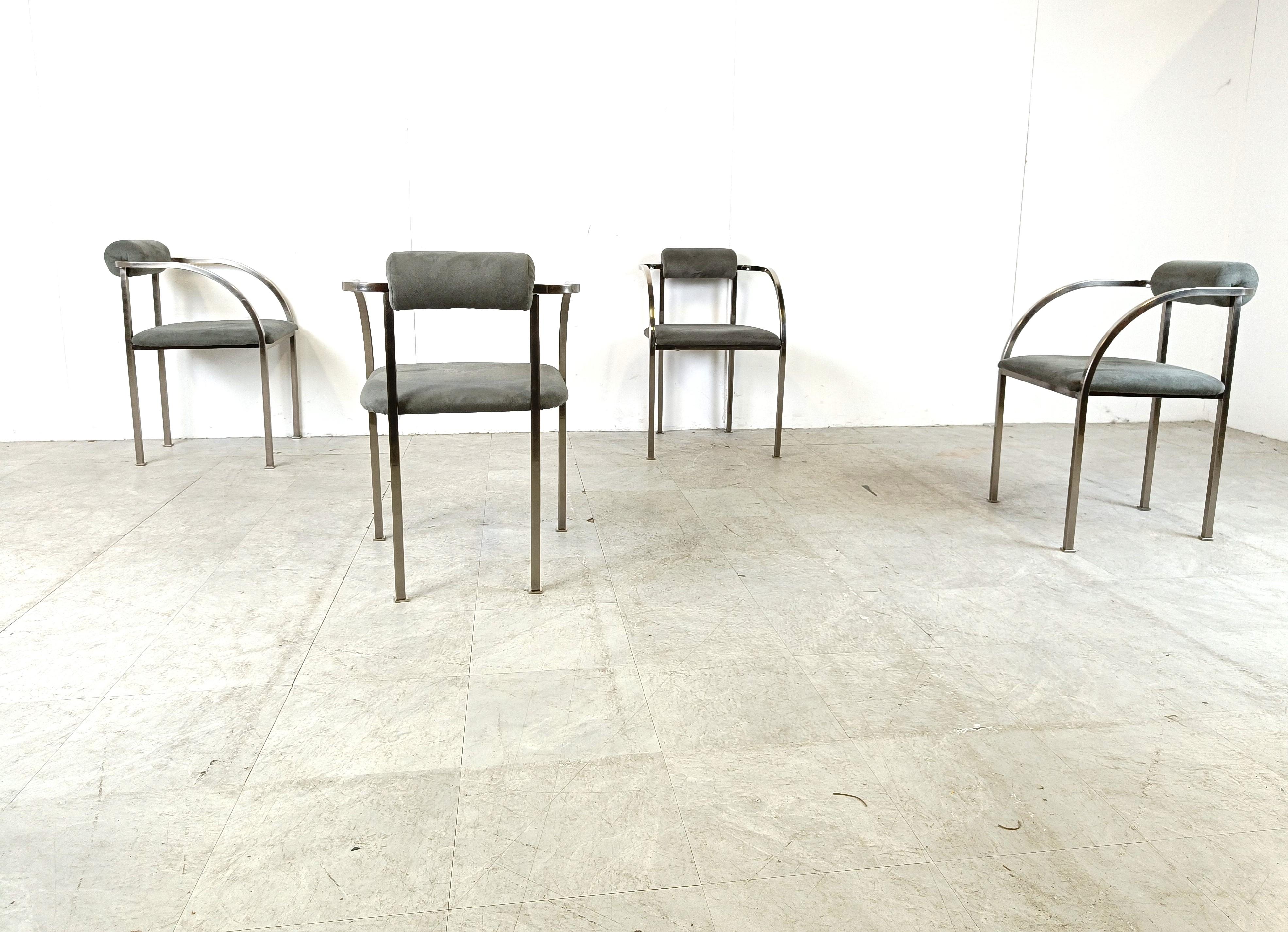 Set of four elegant post modern dining room chairs manufactured by Belgochrom.

Nicely designed metal frames with elegant legs. Upholstered in grey suede.

Belgochrom used to produce high end furniture and was the higher price-range furniture in