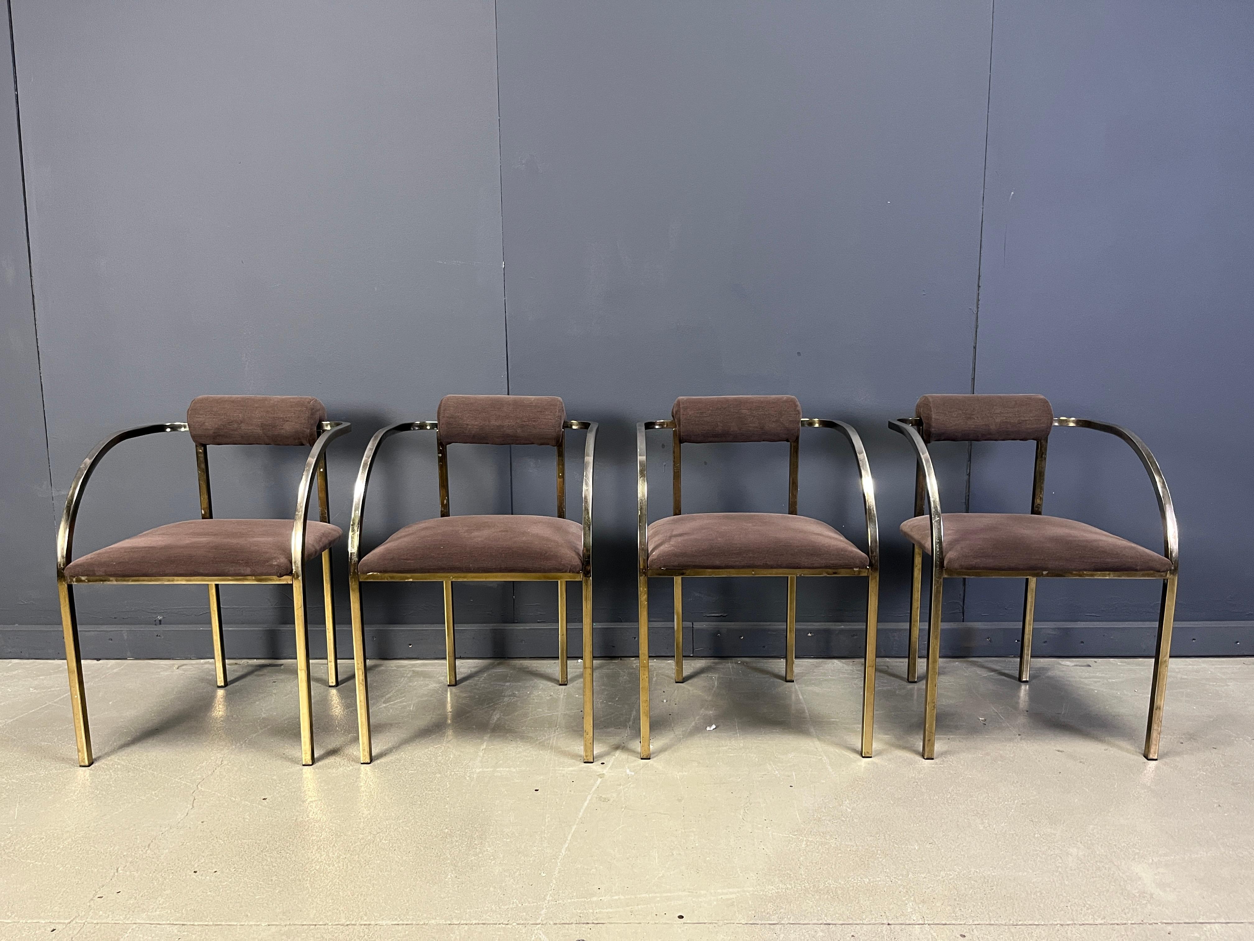 Set of four elegant dining room chairs manufactured by Belgochrom.

Nicely designed patinated brass frames with their original comfy upholstery.

Belgochrom used to produce high end furniture and was the higher price-range furniture in Belgium