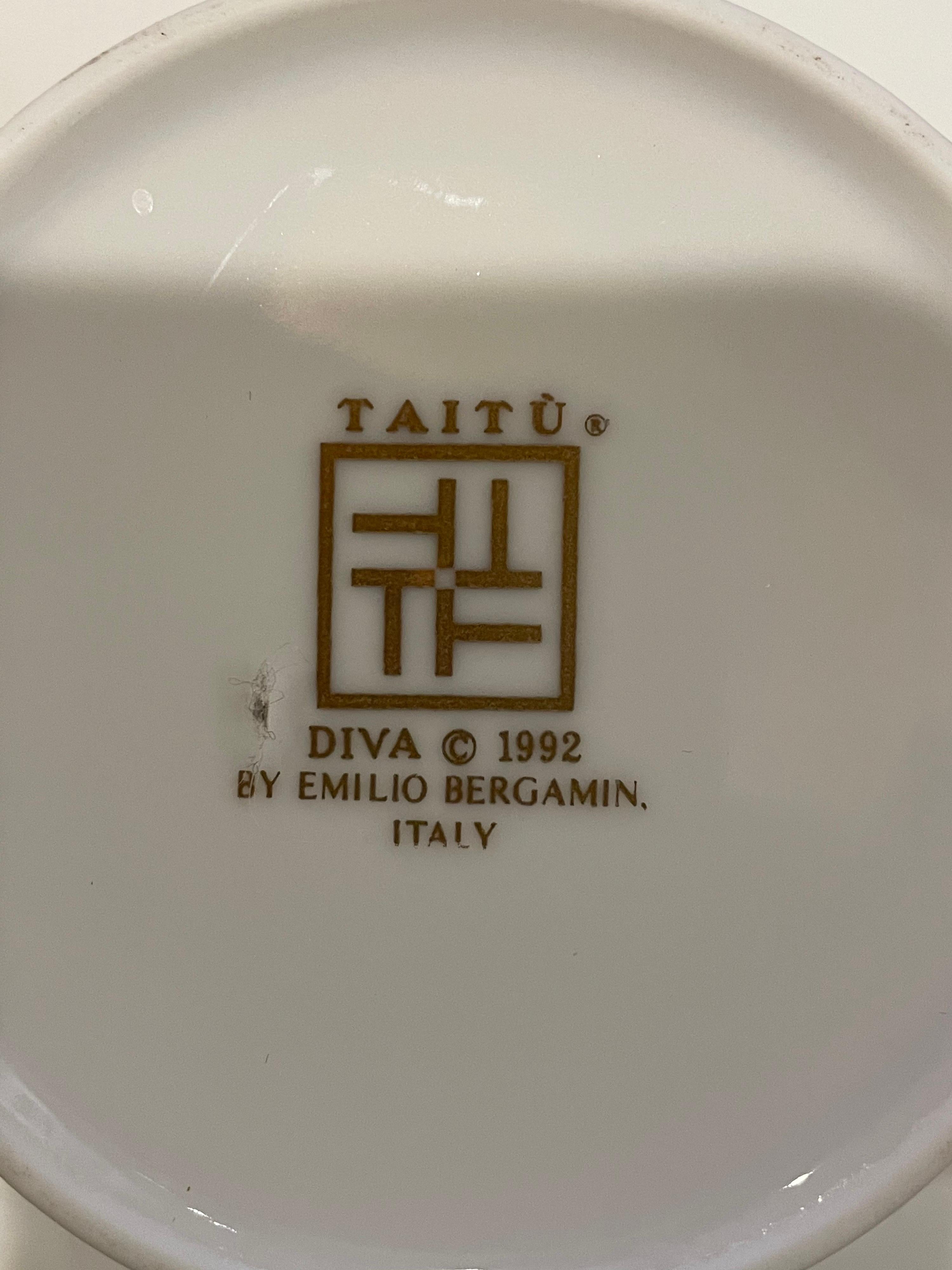 Incredible set designed by Emilio Bergamin for Taitu Italy, circa 1992 Diva set in porcelain with gold accents, 48 pieces we can split the set into 2 sets of 4 if desired, 8 cups, salad plates, soup plates, cup plates, and cups.

Measures: Eight