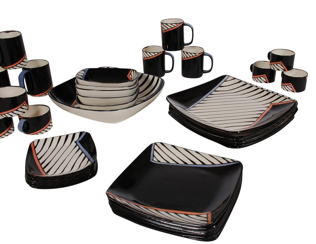 A large set of handmade porcelain dinnerware and coffee / tea service designed by Dorothy Hafner for Tiffany & Co., 1982. The set is being sold as service for six minus one soup bowl. Includes 6 large dinner plates, 6 dessert plates, 6 bread plates,