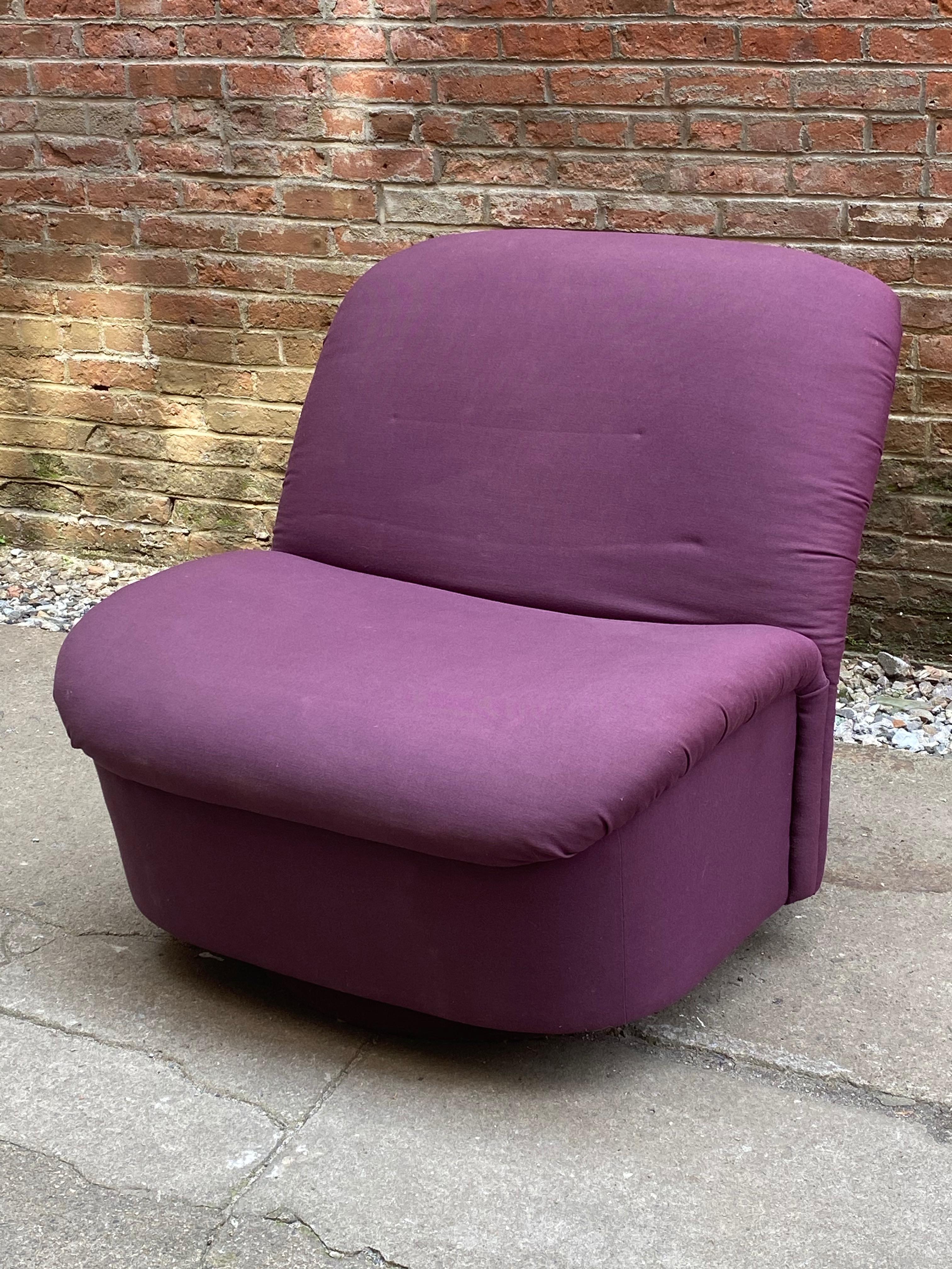 Postmodern directional swivel lounge chair. Signed and labeled, directional, high point, N.C, circa 1988. Maximum comfort aubergine cotton upholstery. Rocks and tilts. Fabric and cushions are in good condition with minor fading due to age and a few