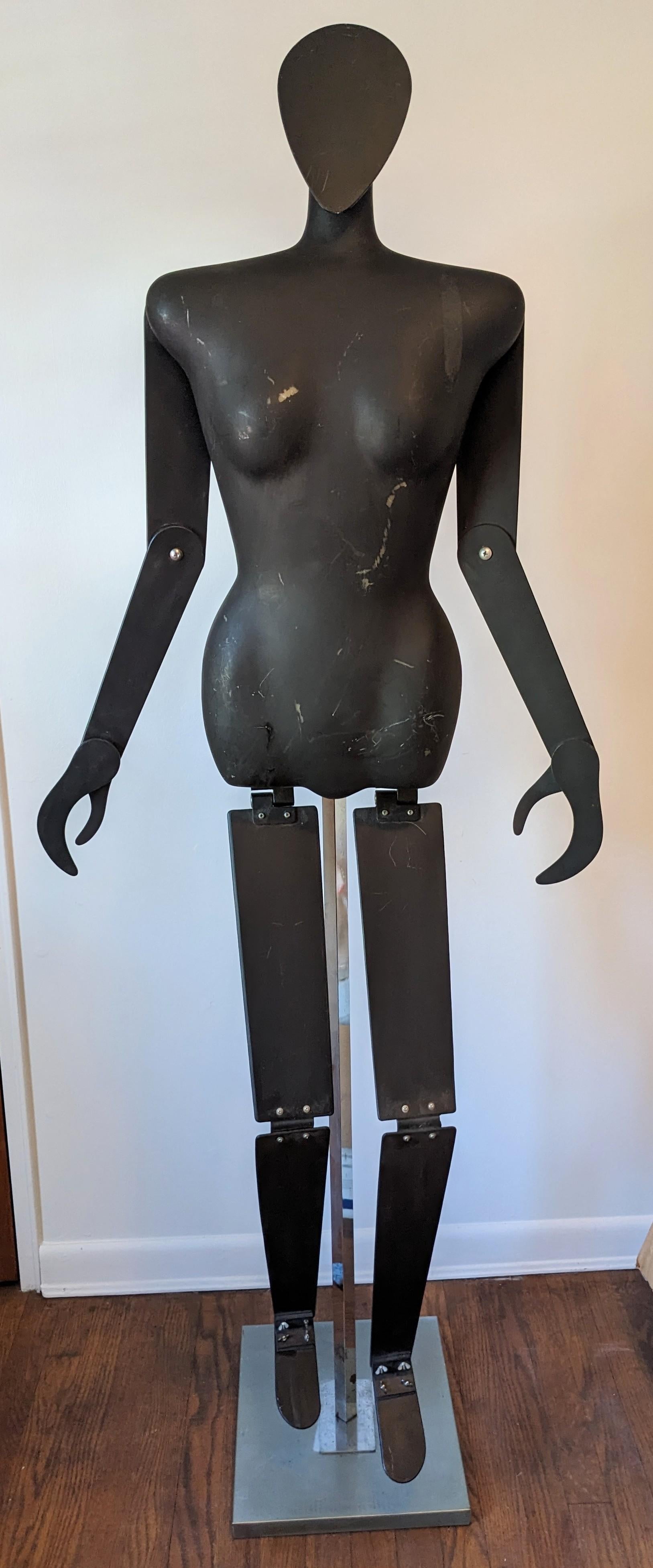 Post Modern Display Mannequin from a Japanese store formerly located on Madison Ave, NY. Articulated fiberglass mannequin body has screws at joints to change positions. Face is separate and would be atttached with velcro tape (missing). Body hooks