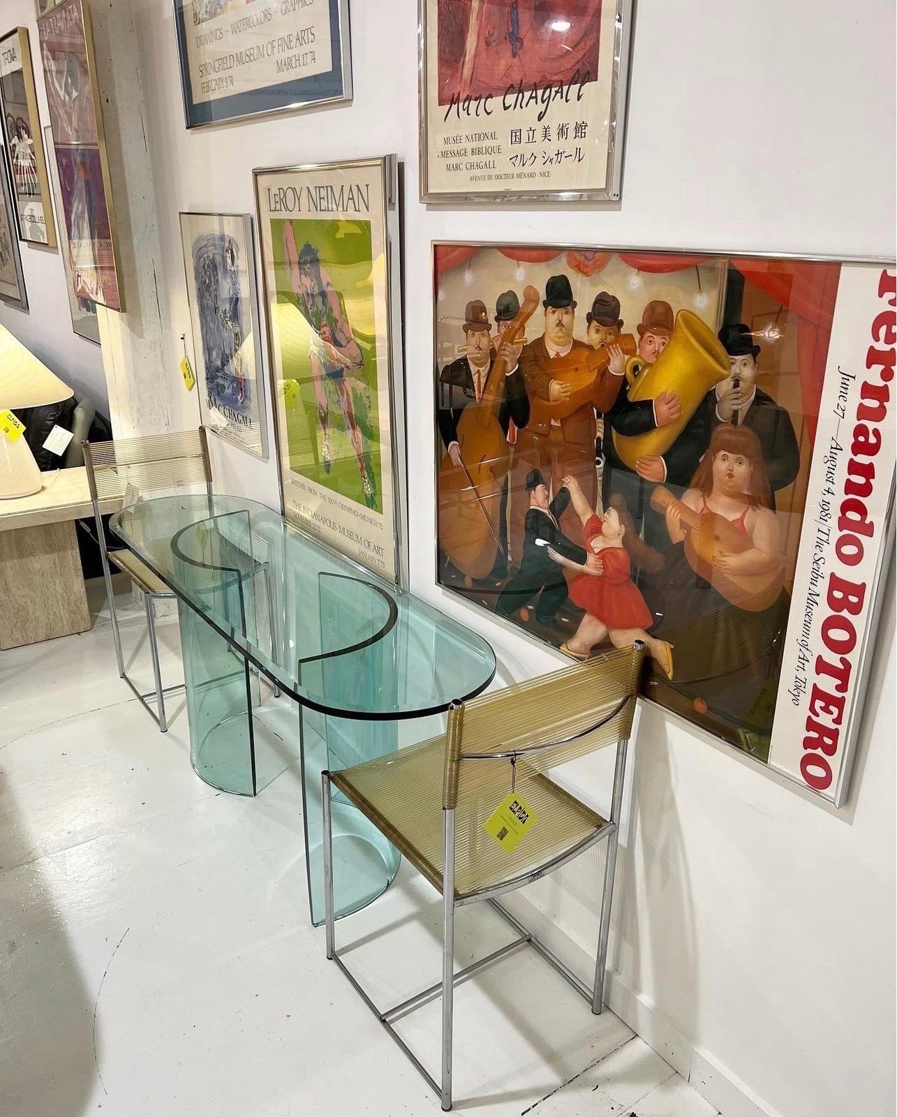 Post Modern double crescent base glass console table.

Bases can be adjusted as shown in photos. This console can also be converted into a low profile coffee table. Use it as a console, vanity, dining, desk or coffee table! 


Measures: 60”W ×
