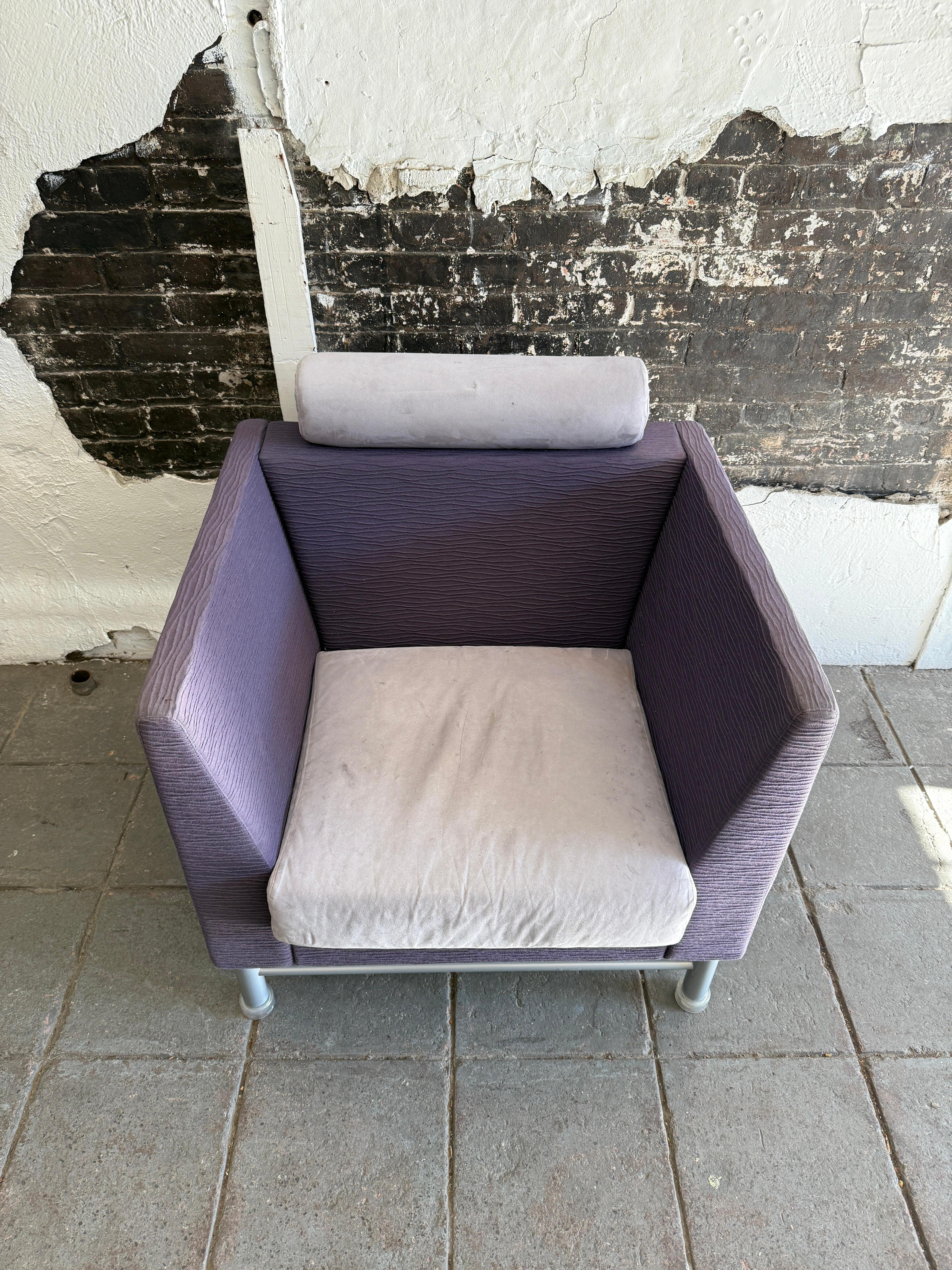 Post modern East side Arm chair designed by Ettore Sottsass for Knoll 1980. Original purple and lavender upholstery. Has knoll pattern under seat and under chair. Has headrest with silver paint steel tube base with clear plastic cap all in good