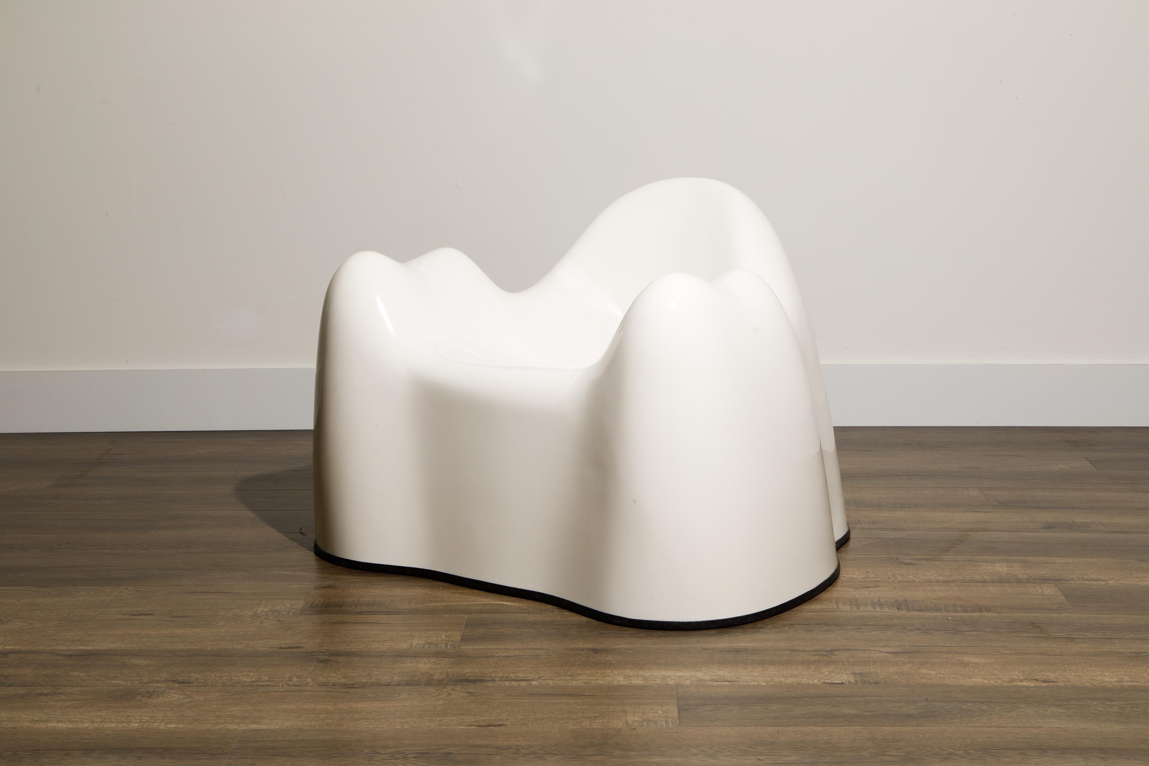 This 'Molar' lounge chair after Wendell Castle is made from gel-coated white fiberglass with black rubber footing. Produced in the early 2000's, stamped 'CLONE' on interior.

This Molar fiberglass club chair would work great in a Post-Modern,