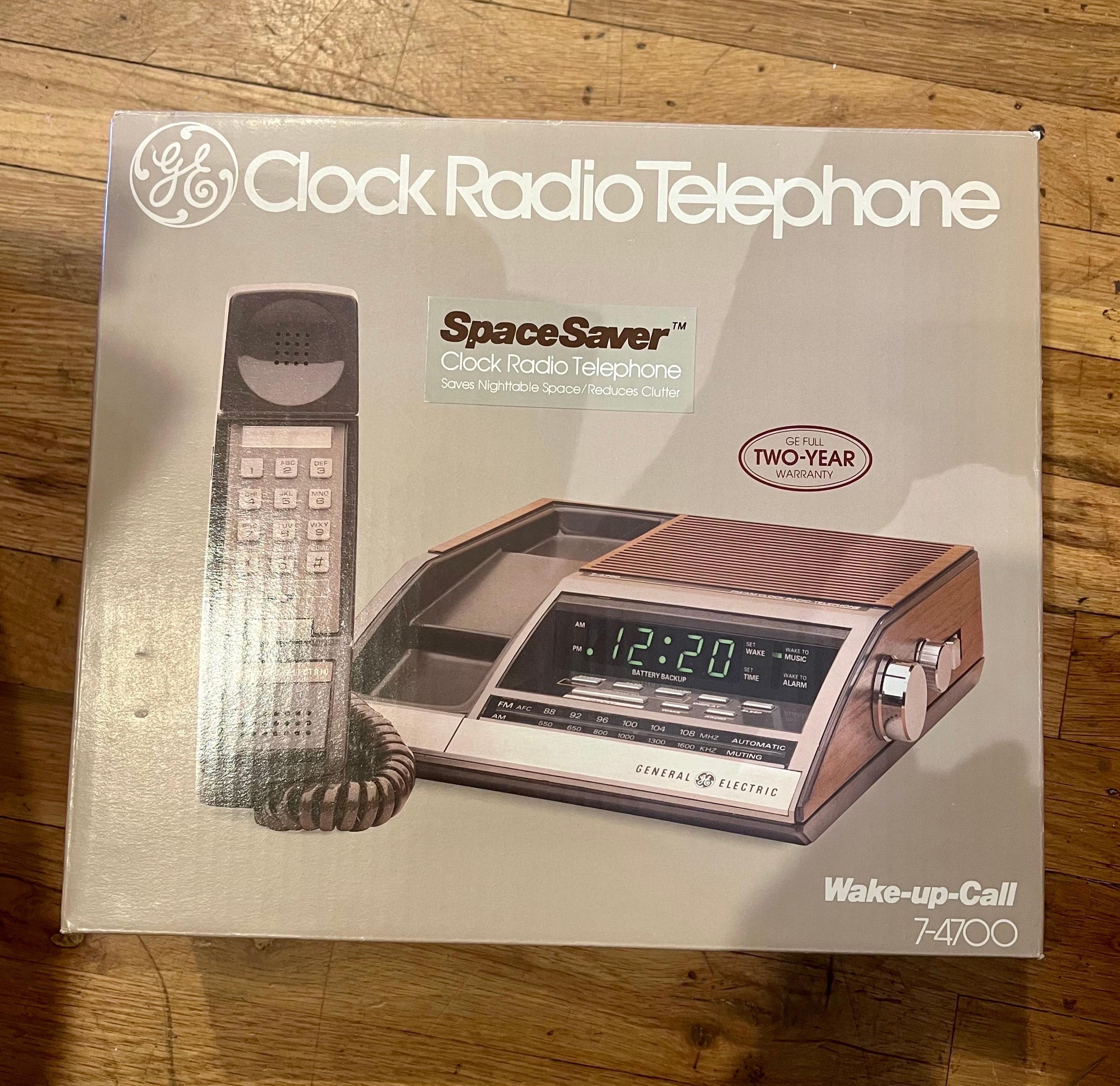 A rare finding new in a box never used 1980s radio alarm AM/FM phone clock, all new original box, manual, and cords.