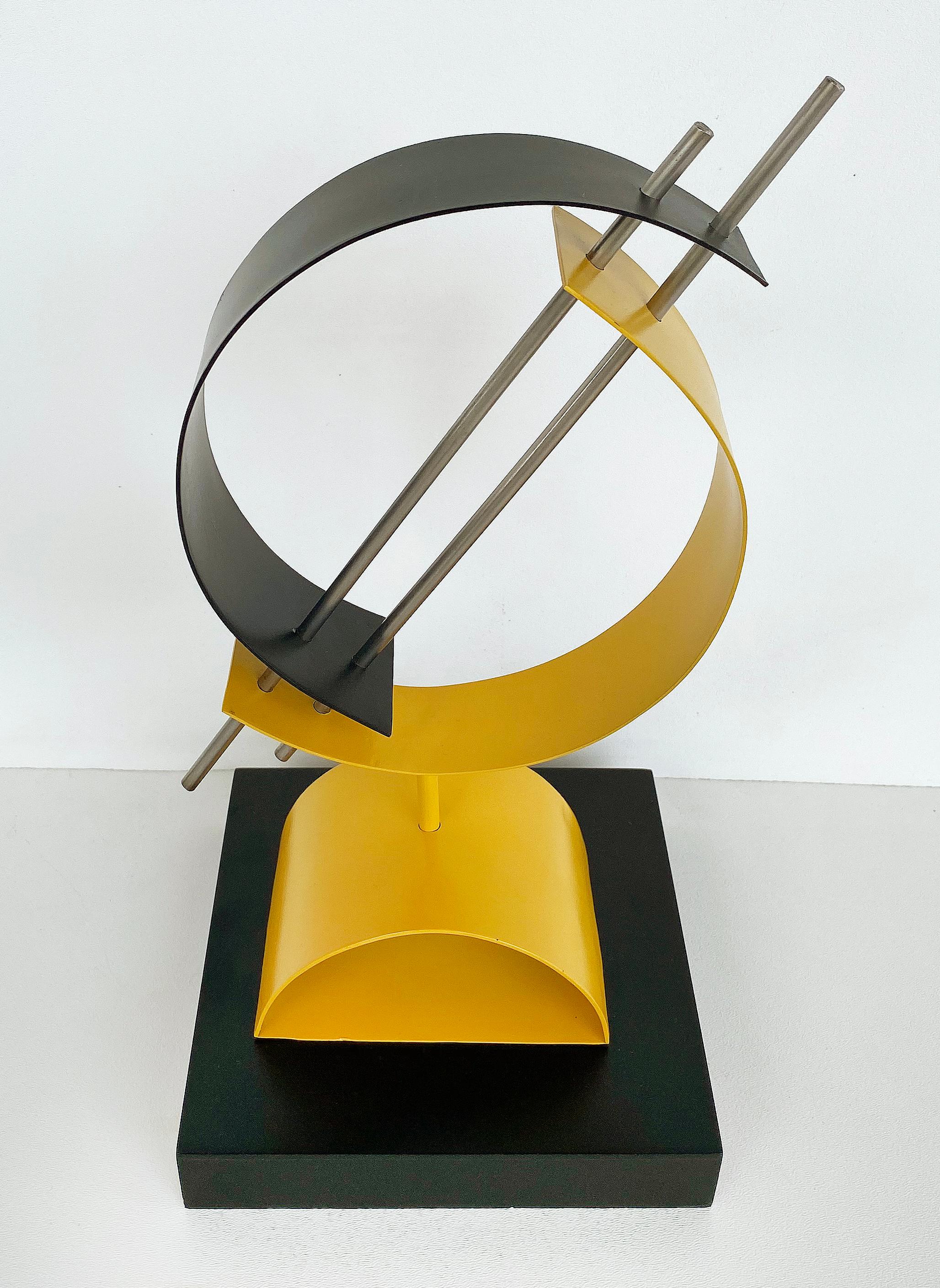 Post-Modern Geometric abstract metal table sculpture on wood base

Offered for sale is a postmodern geometric metal and wood sculpture. This composition resembles the work of geometric abstract sculptures from artists such as Edgar Negret, John