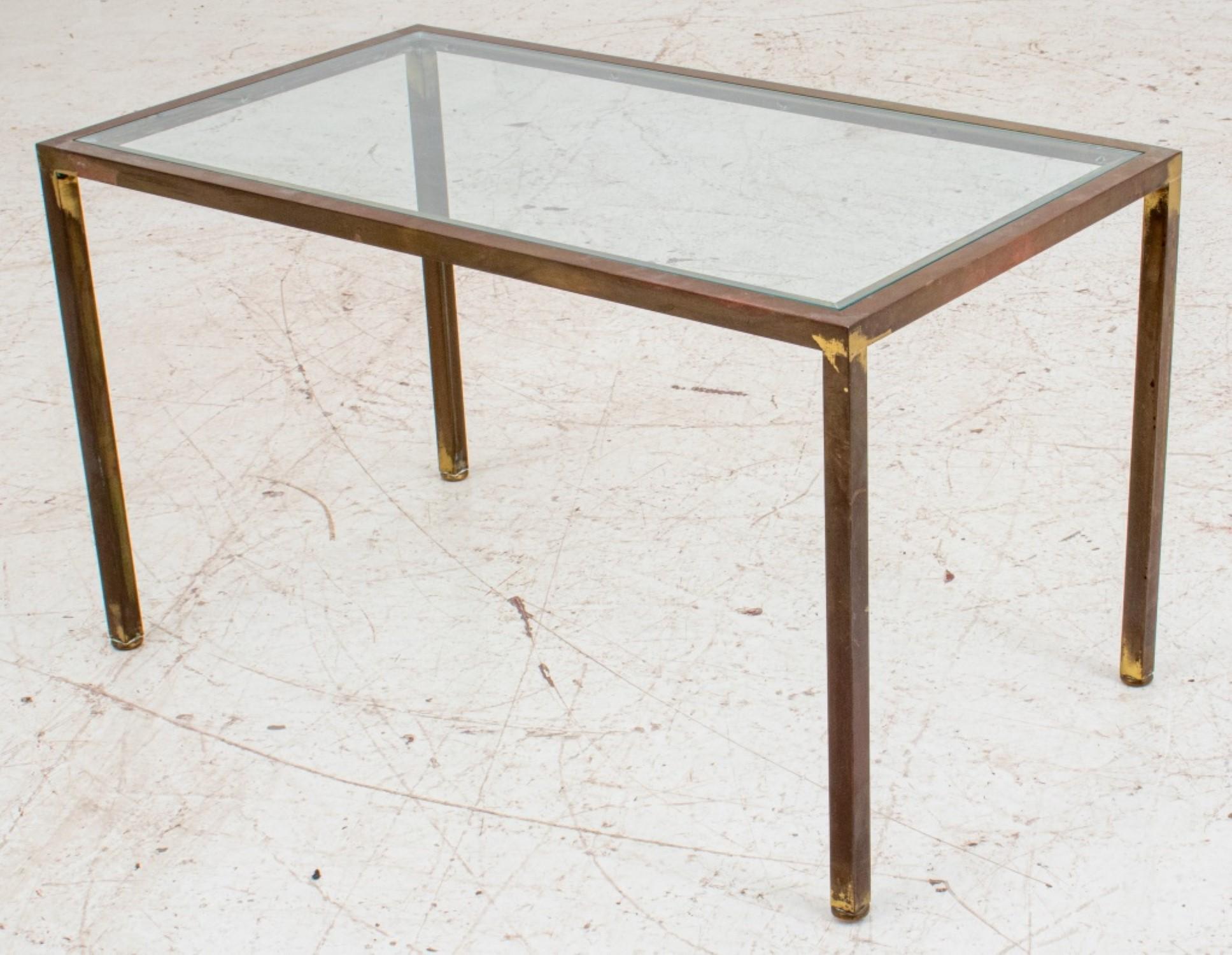 
Post-Modern Gilt Metal Coffee Table
Based on the description, this piece appears to be a post-modern coffee table with the following characteristics:

Style: Post-modern
Material:
* Base: Gilt metal - Likely metal covered in a thin layer of gold,