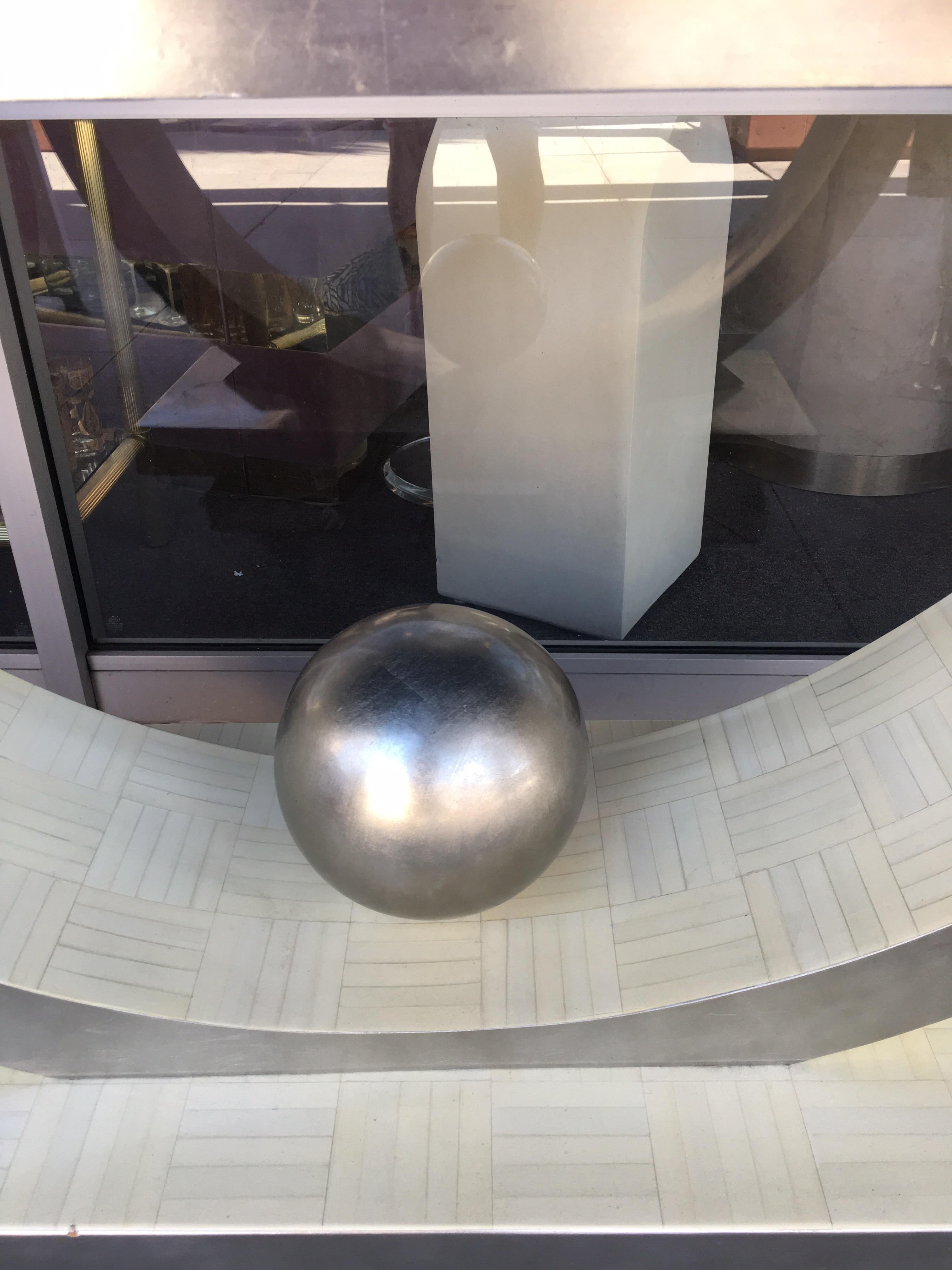 This gorgeous 1980s console table came from a very high-end country club residence in Palm Springs California. It was custom made by the designer for the home. Very glamorous Postmodern meets Art Deco modern design. Made with real silver-leaf and