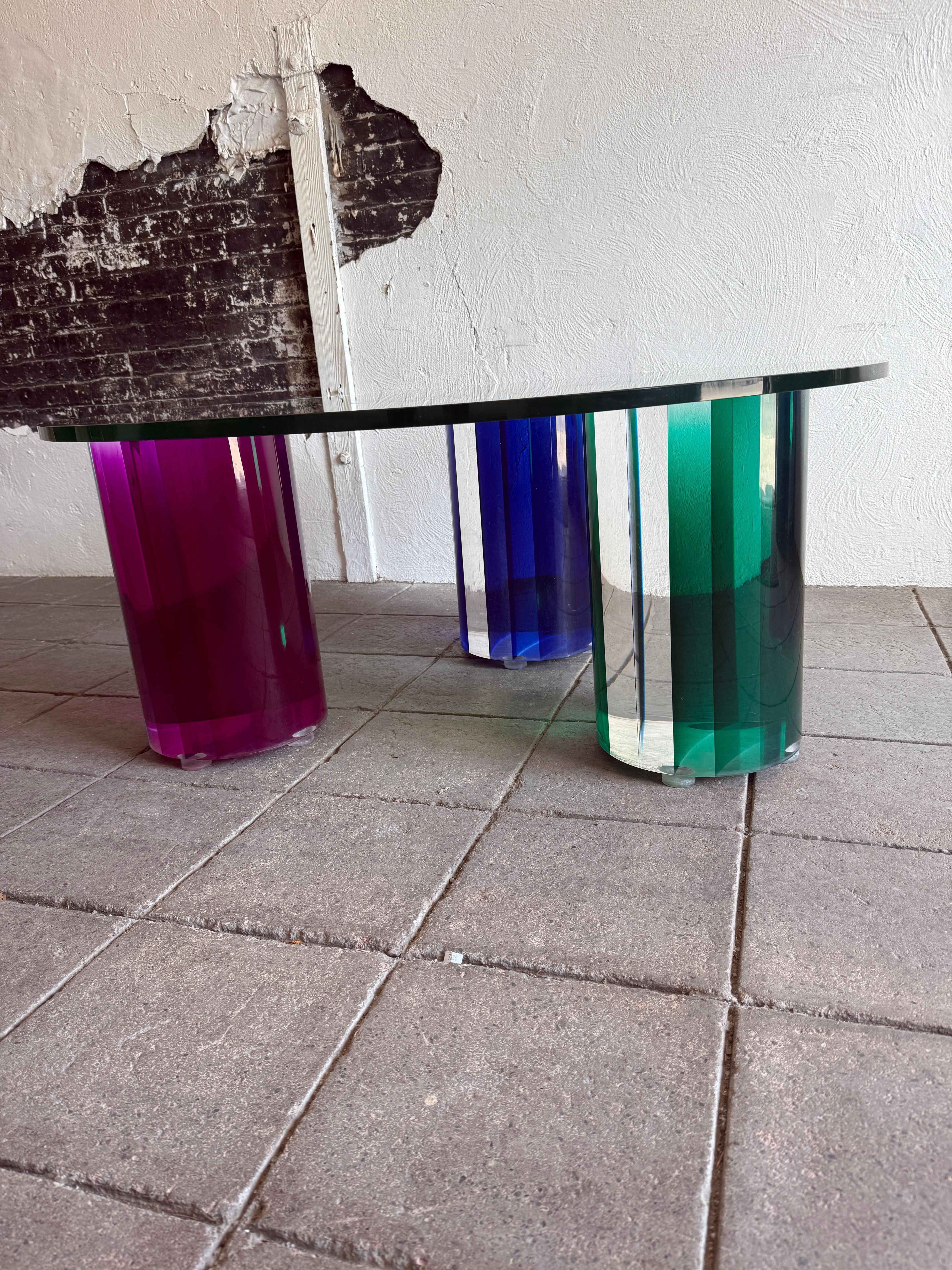 Post modern glass Coffee Table with color plexiglass round bases In Good Condition For Sale In Brooklyn, NY