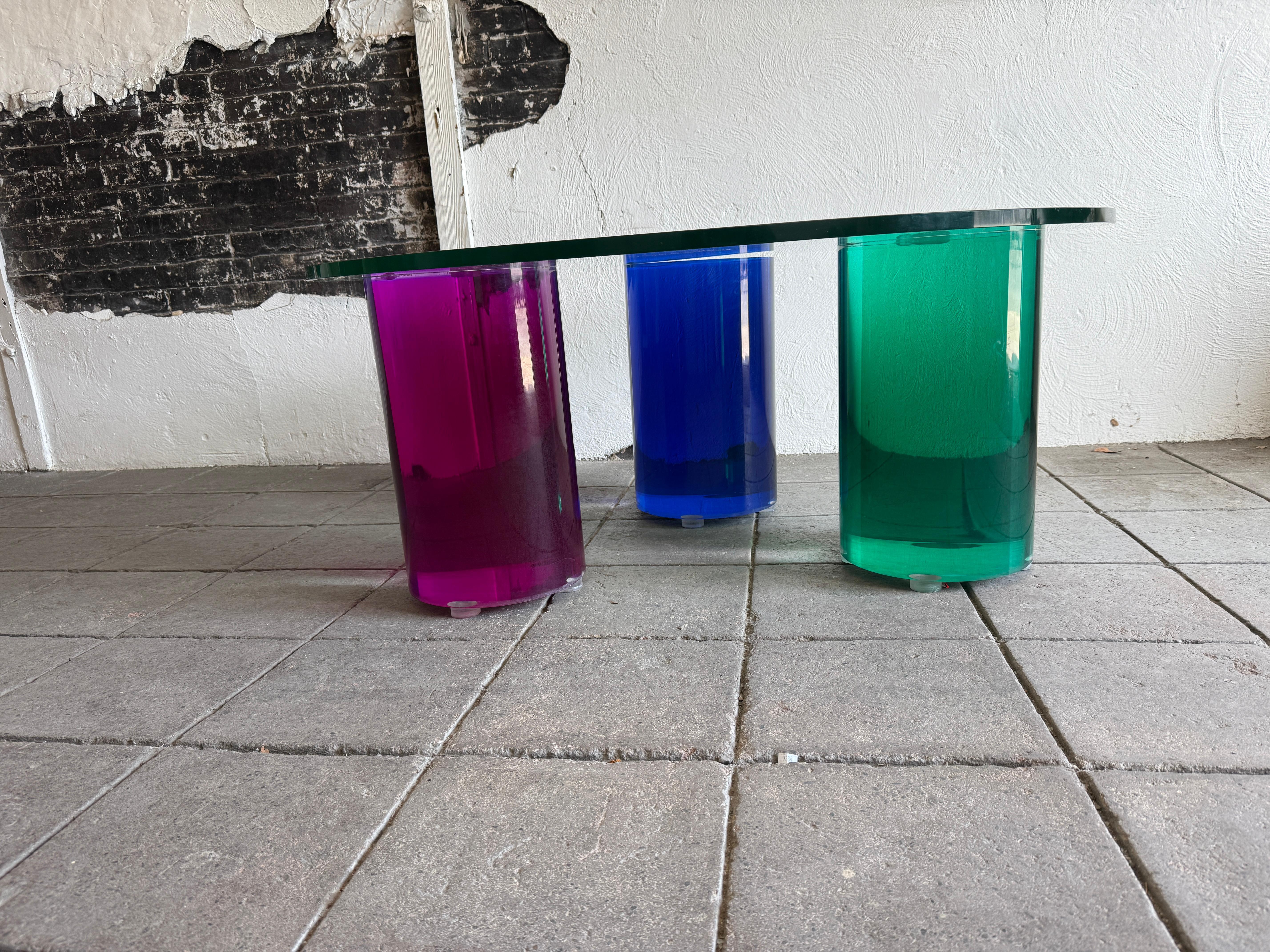 Glass Post modern glass Coffee Table with color plexiglass round bases For Sale