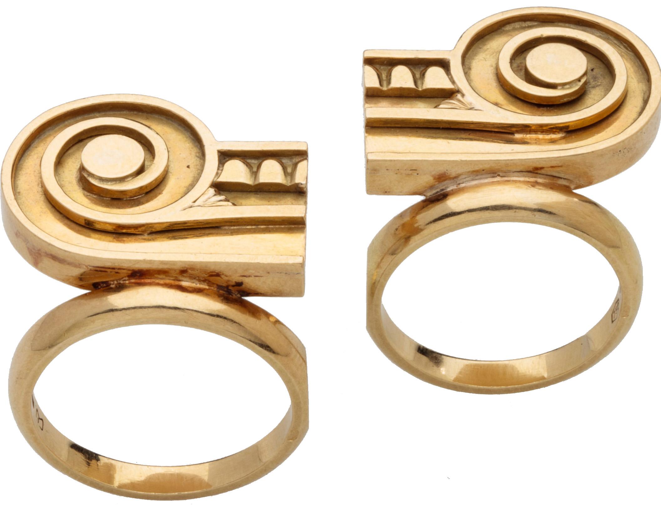 Ionic Capital Rings by Stanley Tigerman
United States and Italy, 1986-1987
Complete width 46 mm., diameter of hoops 21 mm. and 22 mm., bezel when worn together 19 x 46 mm.
Weight 22 gr., US sizes 7 and 8.5, UK sizes O and Q ¾ 

The two gold rings