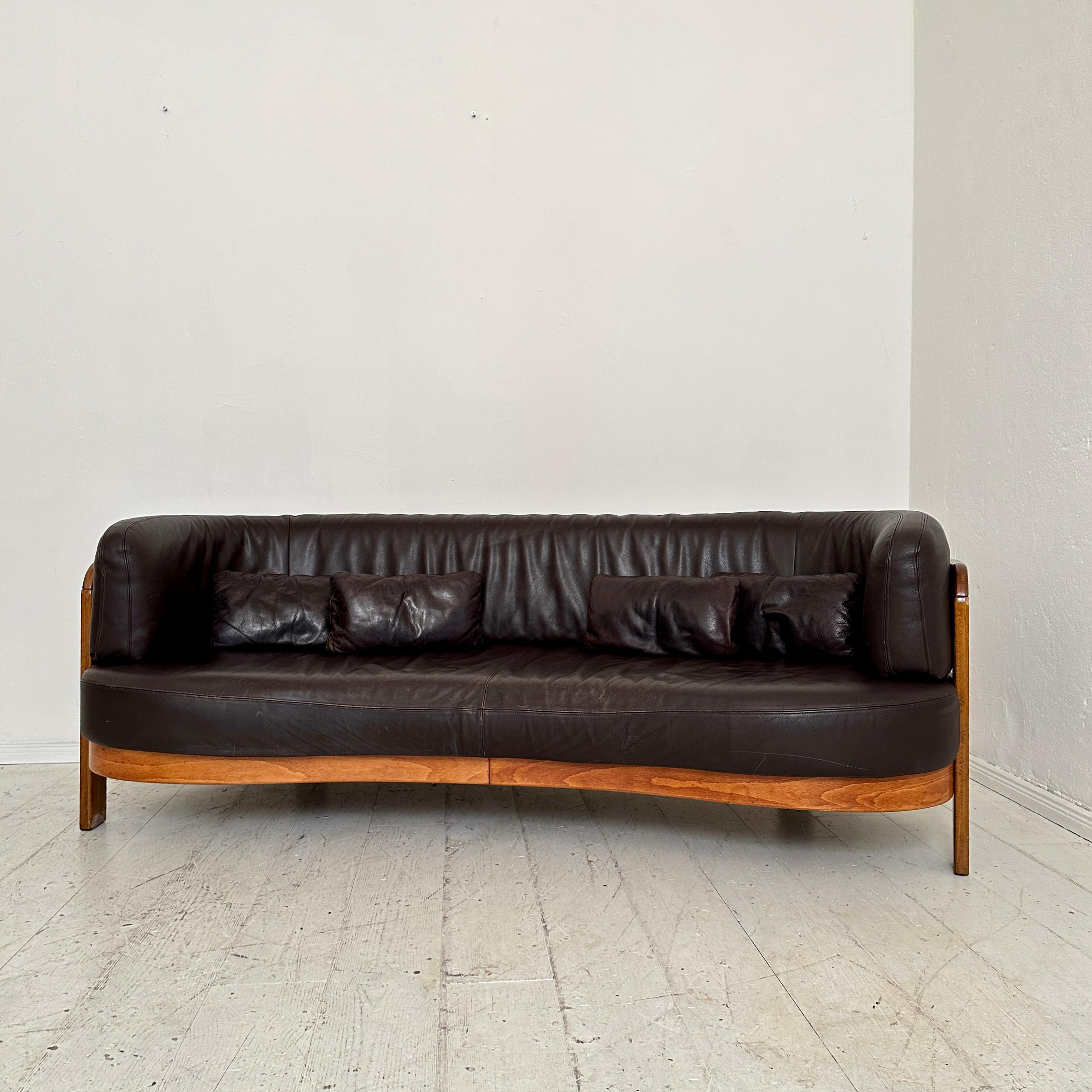 Beautiful Post-Modern Halfround Leather Sofa attributed to Hans Ell and was done around 1980.
The base is made out of beech and the cushions are done in brown leather.
A unique piece which is a great eye-catcher for your antique, modern, space age