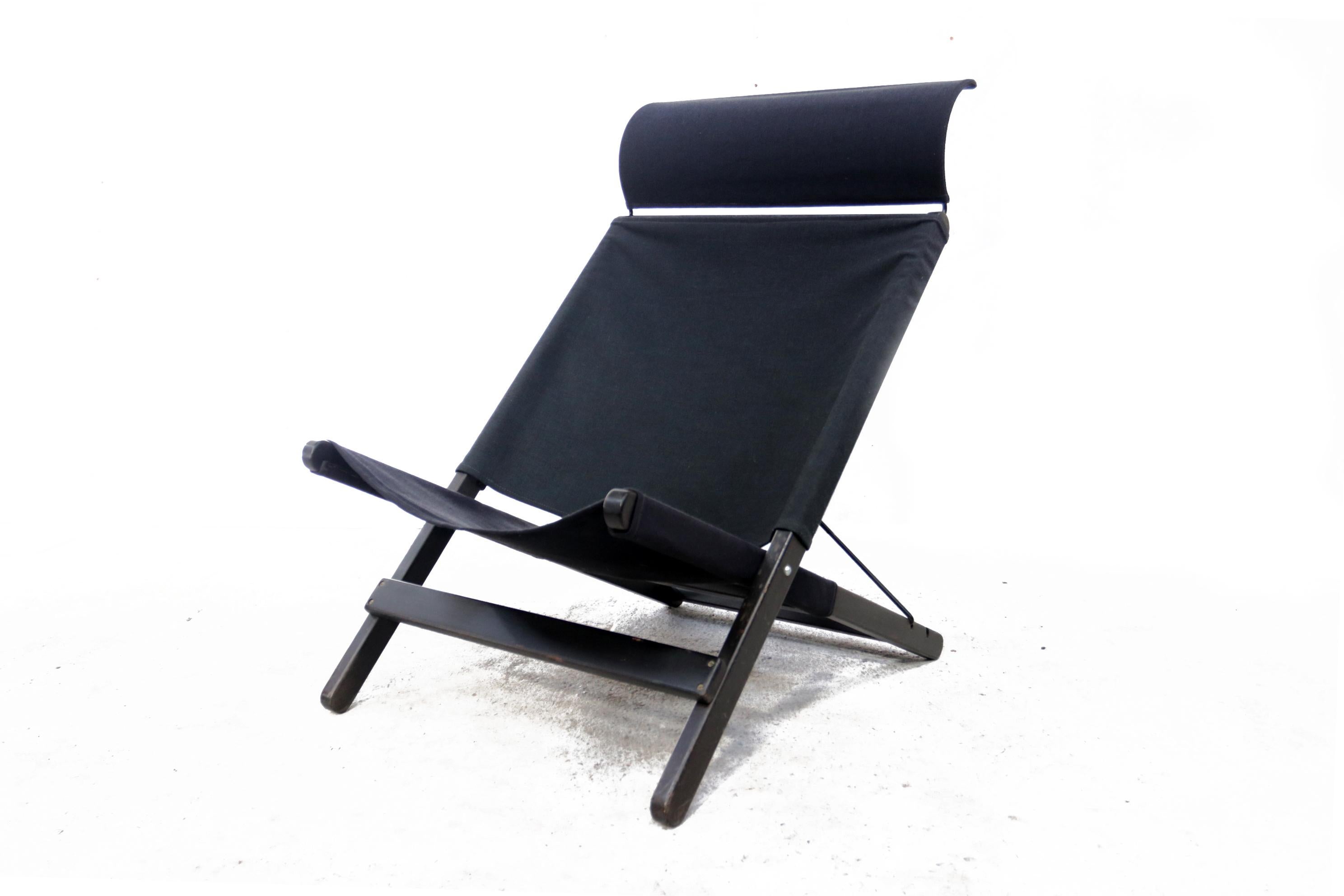 Design folding chair designed by Tord Björklund for Ikea in 1991.
The model is called Hestra. Made from thick jeans fabric, wooden frame and metal cross and headrest.
This chair fits like a hammock, so close your eyes and you're on vacation!
 