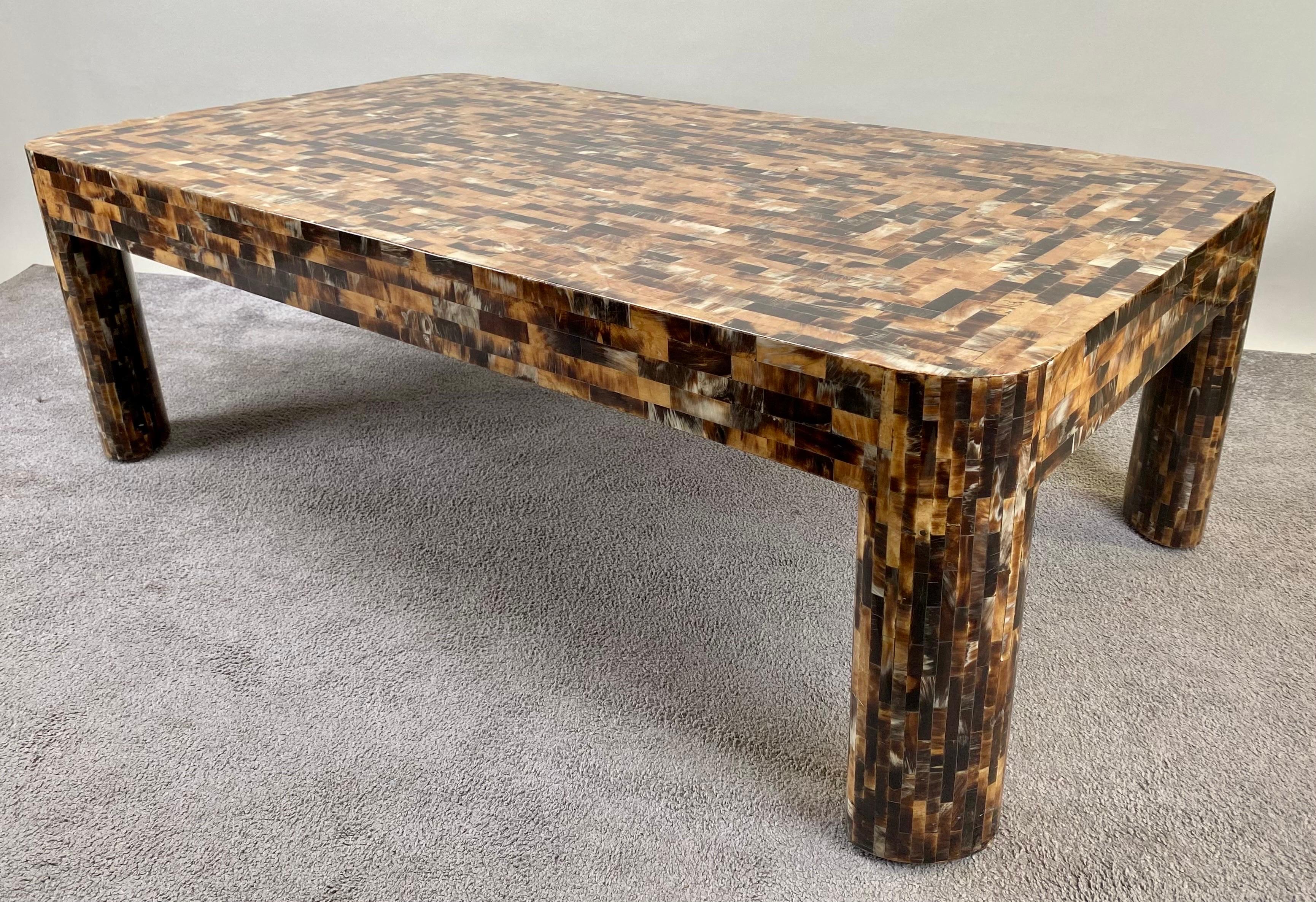 A Post-Modern large rectangular Elegant tessellated horn inlay console table—a true masterpiece in craftsmanship. Painstakingly constructed from a mosaic of hundreds of alternating animal horns and antlers, this table boasts a distinct and