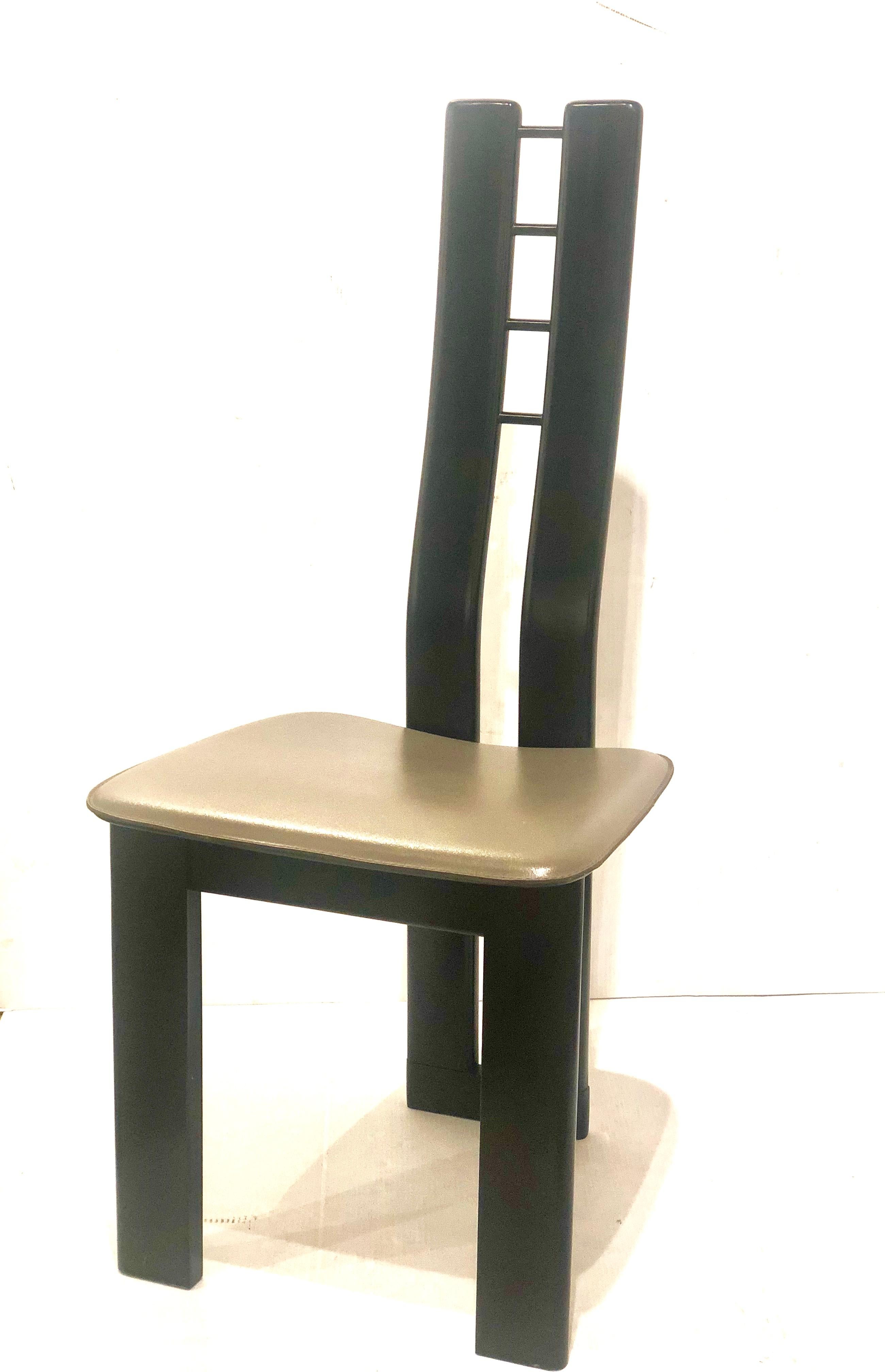 Beautiful and elegant design, on this unique tall back side chair in leather seat with ebonized wood frame in satin finish, circa 1980s. A Klassik Memphis era design solid and sturdy great sculptural accent chair.