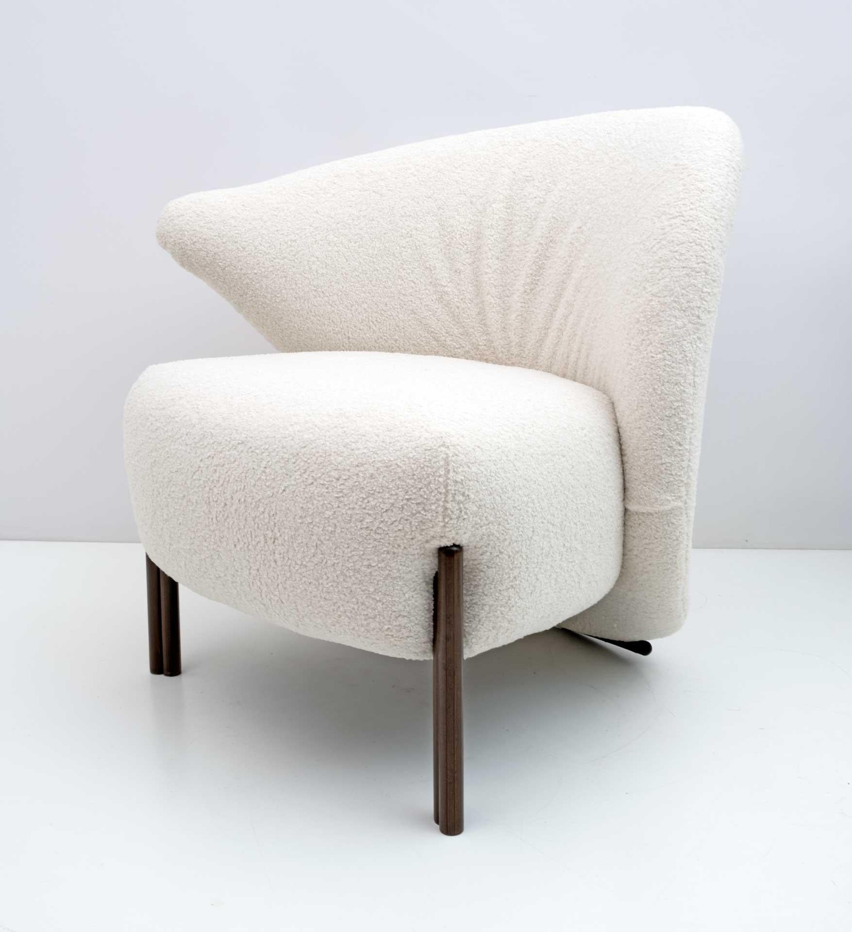 Italian armchair with a postmodern design, produced in the 80s. Completely restored and with new upholstery in fine Bouclè.