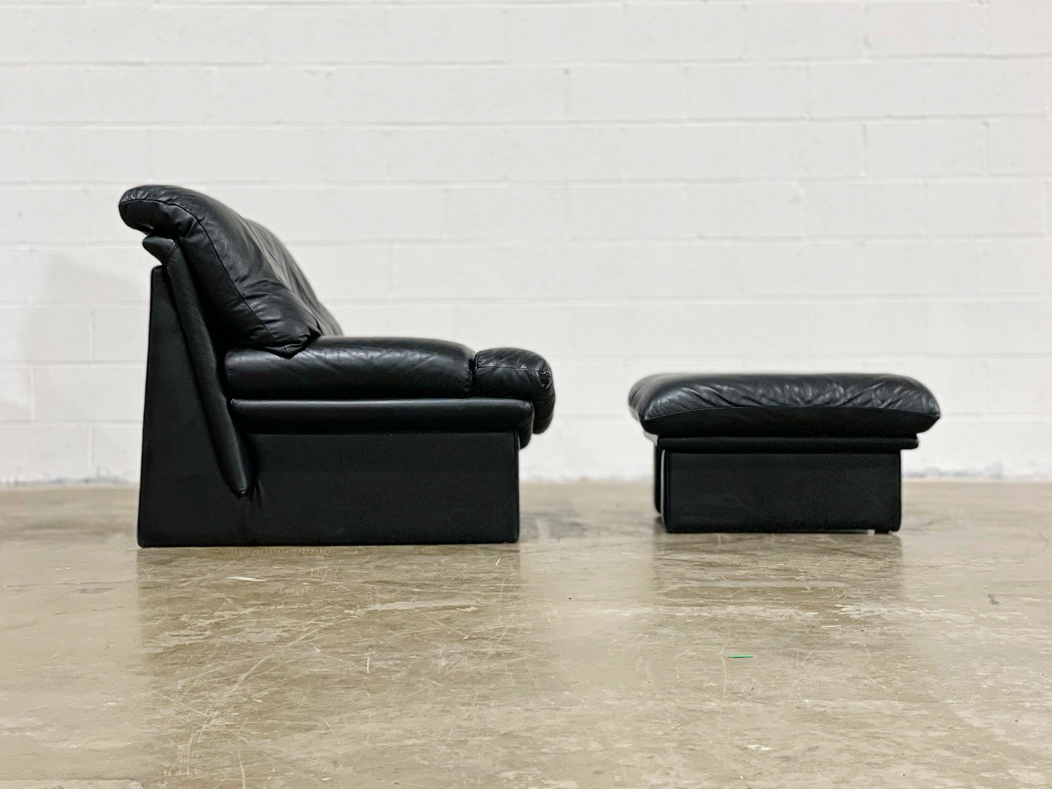 Gorgeous post modern lounge chair and ottoman by Nicoletti Salotti, Italy circa 1980s. High grade top grain black Italian leather. Striking and stark angular lines for a stunning silhouette. Attended to by our team of in house craftspeople - the