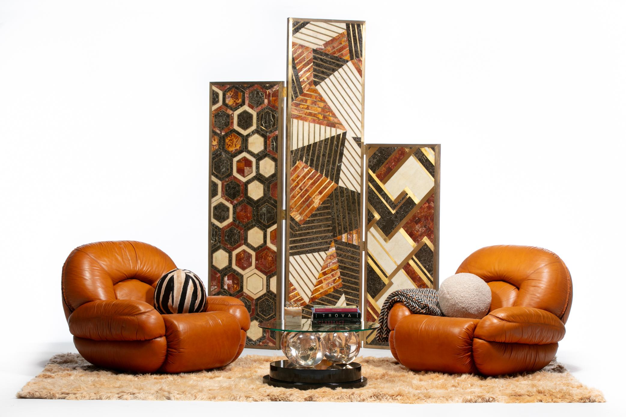 If you want to live La Dolce Vita, do so in these incredibly stylish Italian Post Modern lounge chairs with surround oversized and overstuffed cushions in supple carmel leather. Designed to satisfy all the senses. Chic Italian looks from the front,