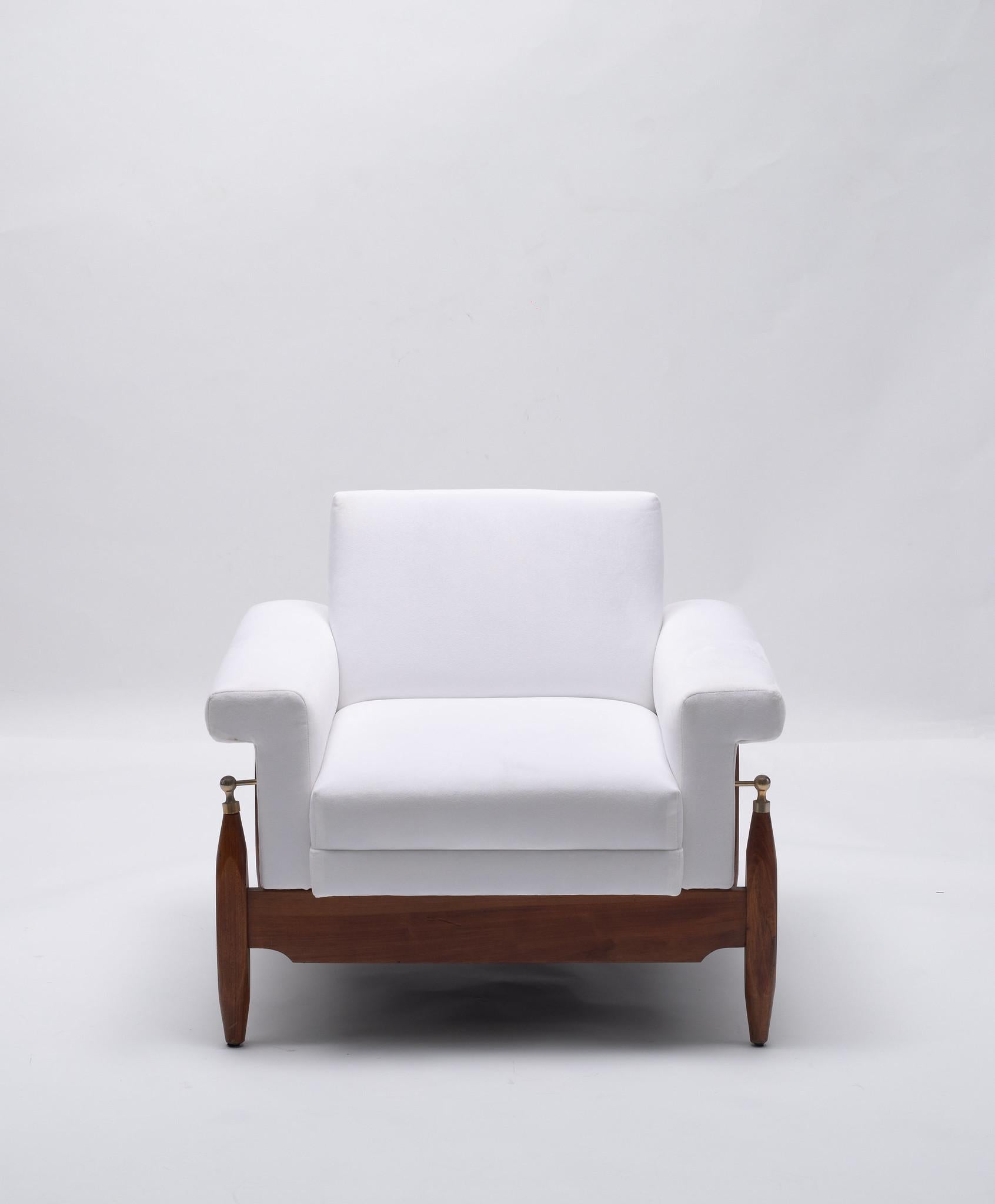 A stylized chic Italian lounge chair. Sturdy solid fruitwood frame with steel stanchions that support arms and seat. All professionally padded and upholstered in a low pile white velvet.