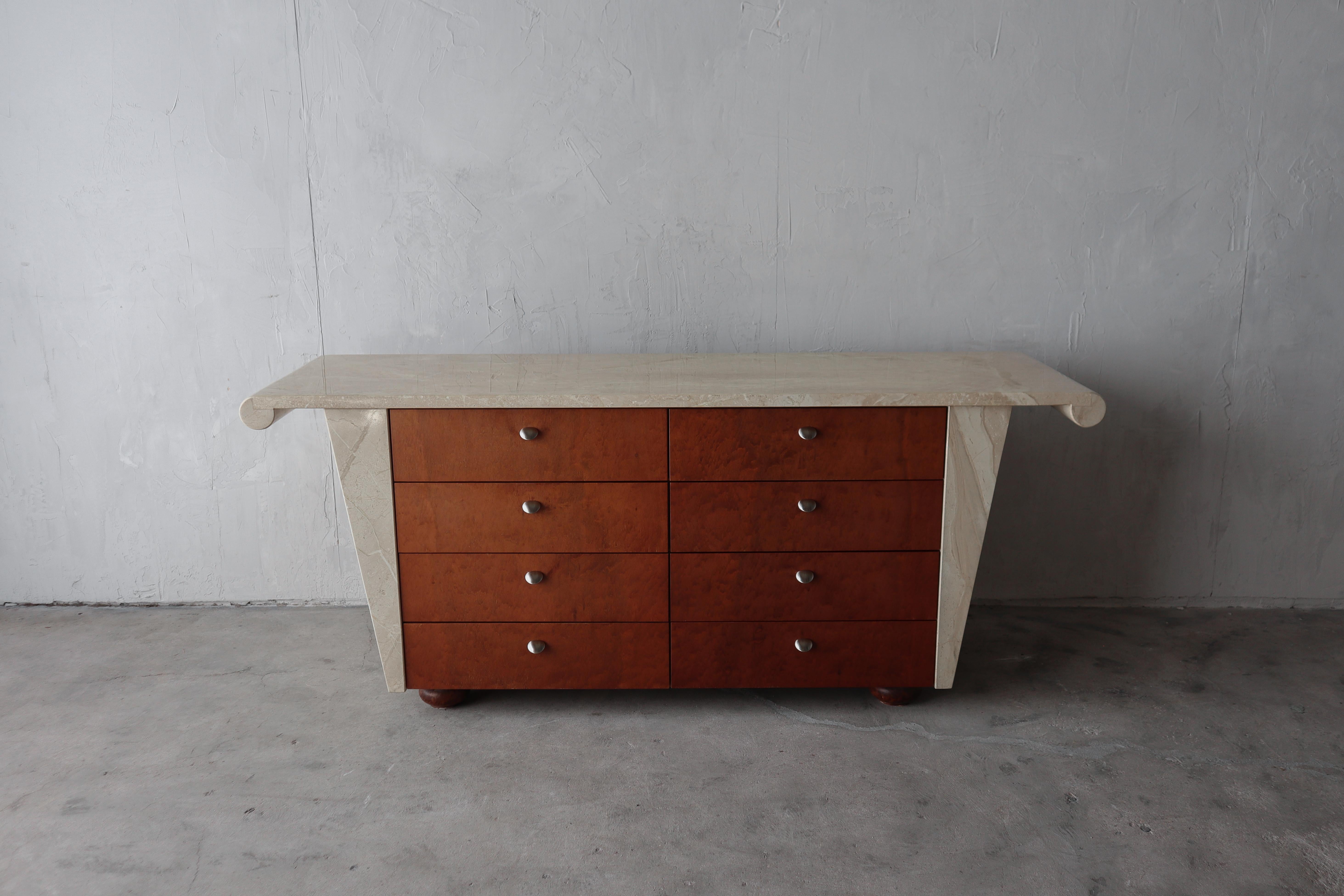 Very unique post modern buffet. This piece has a beautiful solid marble top and sides. It has 8 good sized drawers for ample storage. It could be used as a buffet, sideboard, credenza or dresser, it's a truly unique and beautiful piece that would