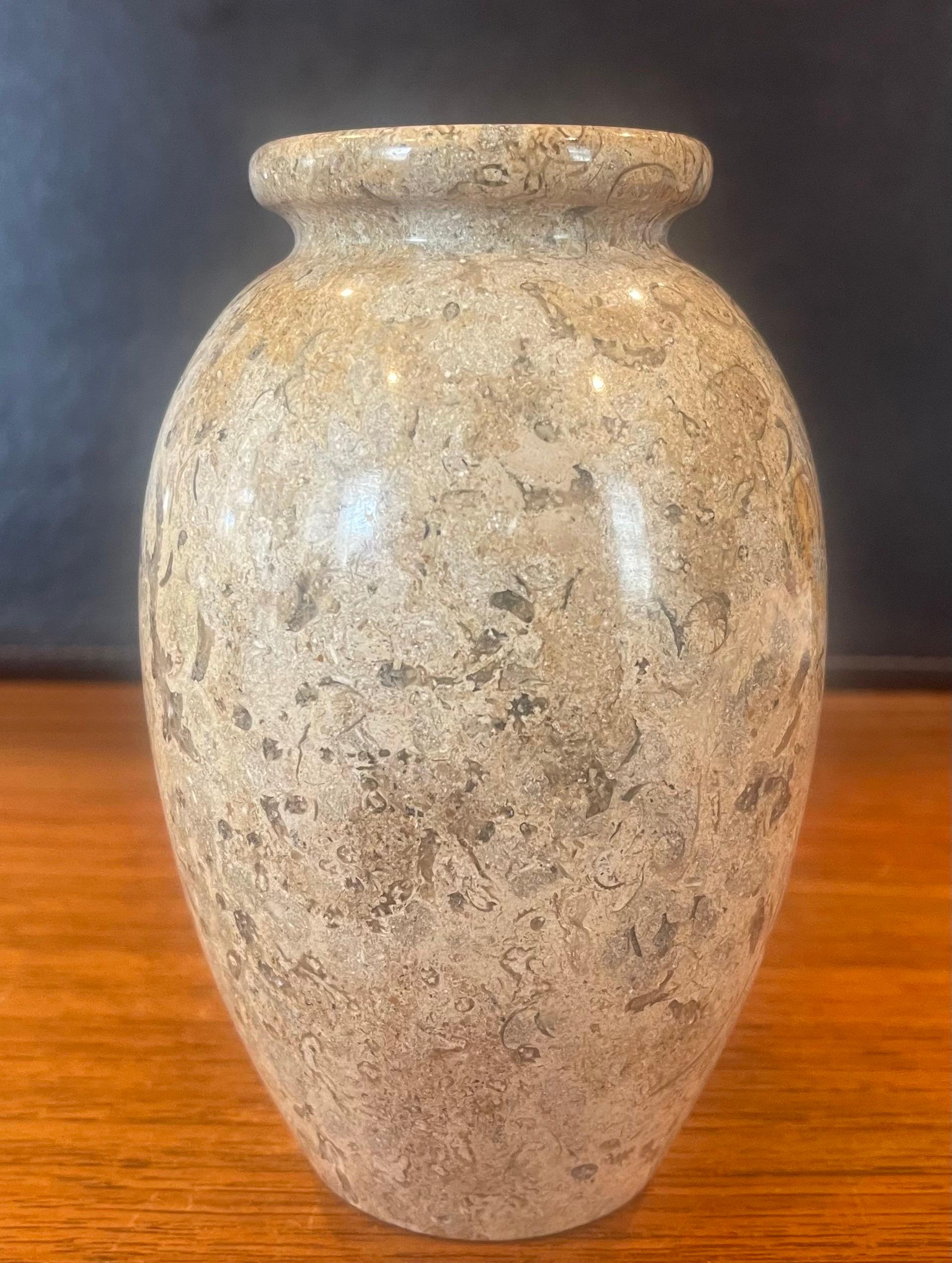 Small post-modern Italian marble vase, circa 1980s. The vase is primarily a dark tan in color, but has cream, black and grey veining throughout. The vase is in very good vintage condition with no chips or cracks and measures 4