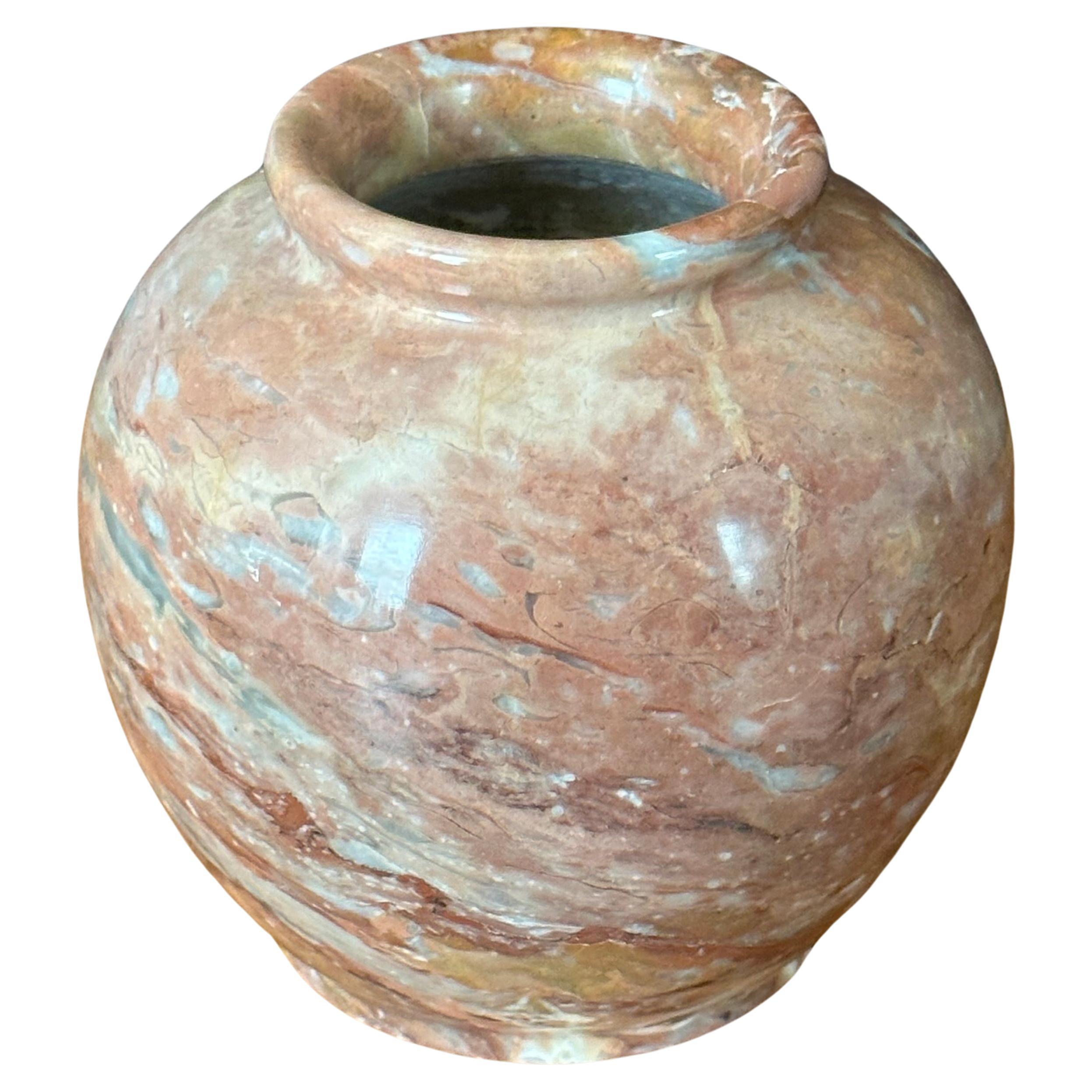 Small post-modern Italian marble vase, circa 1980s. The vase is primarily a dark tan in color, but has cream, black and grey veining throughout. The vase is in very good vintage condition with no chips or cracks and measures 5